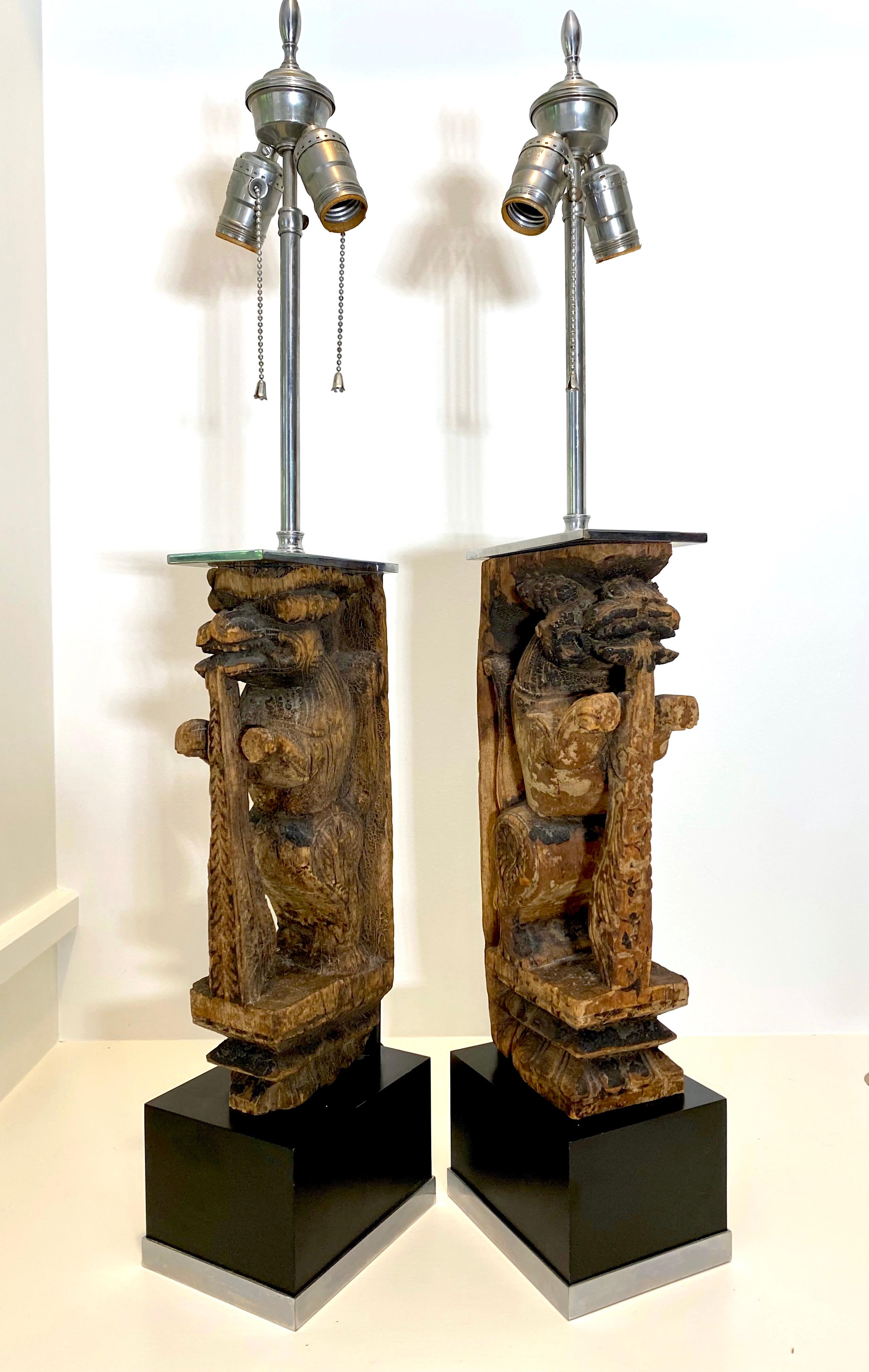 Pair of Table Lamps with Hand Carved Temple Lions Mounted in Nickel In Good Condition For Sale In New York, NY