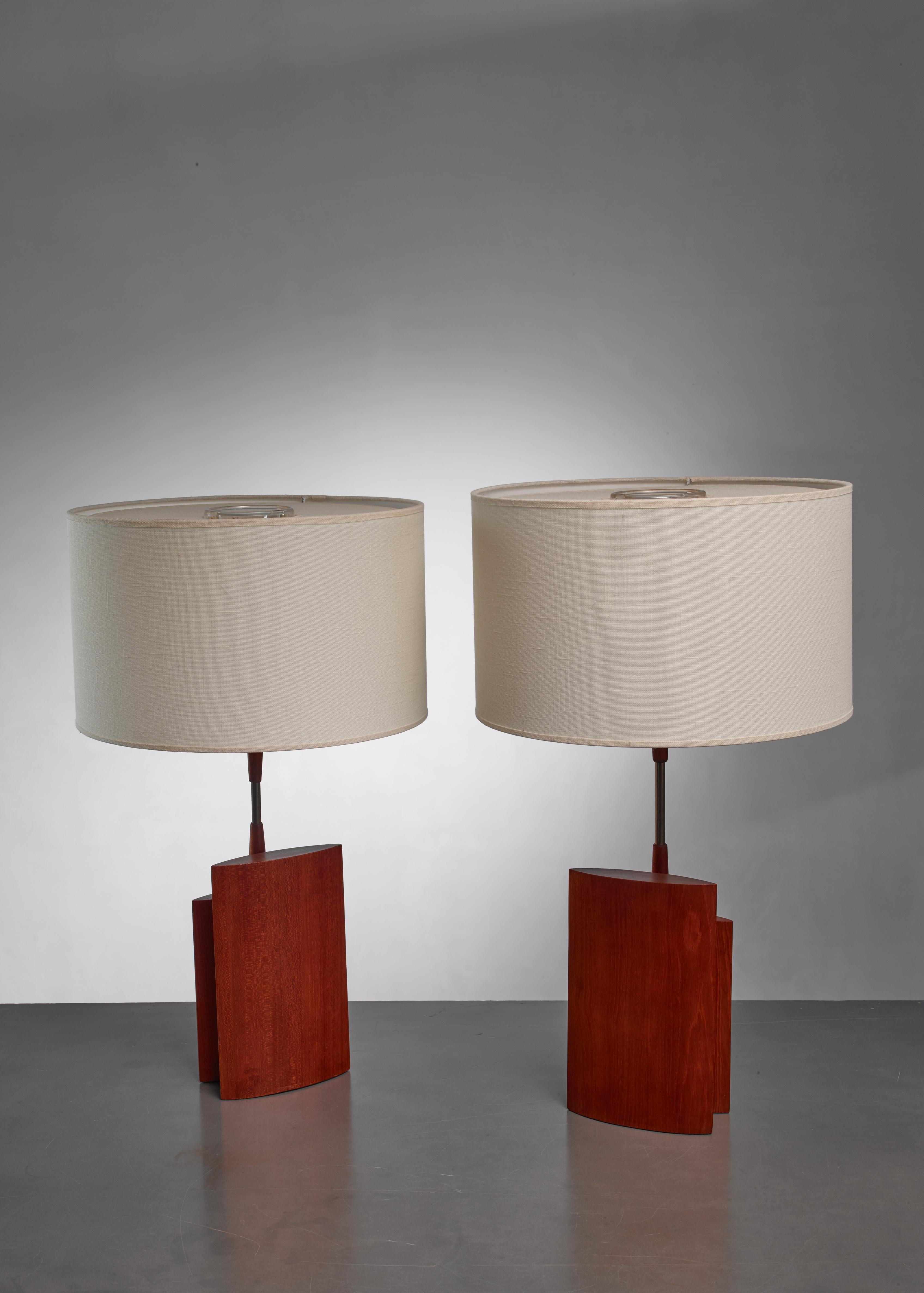 A pair of Danish table lamps made of two ellipsoid parts of wood with a brass stem. The lamp features two asymmetric ellipsoid wood pieces with the brass stem in the centre. The measurements are of the base of the lamps without a shade and measured