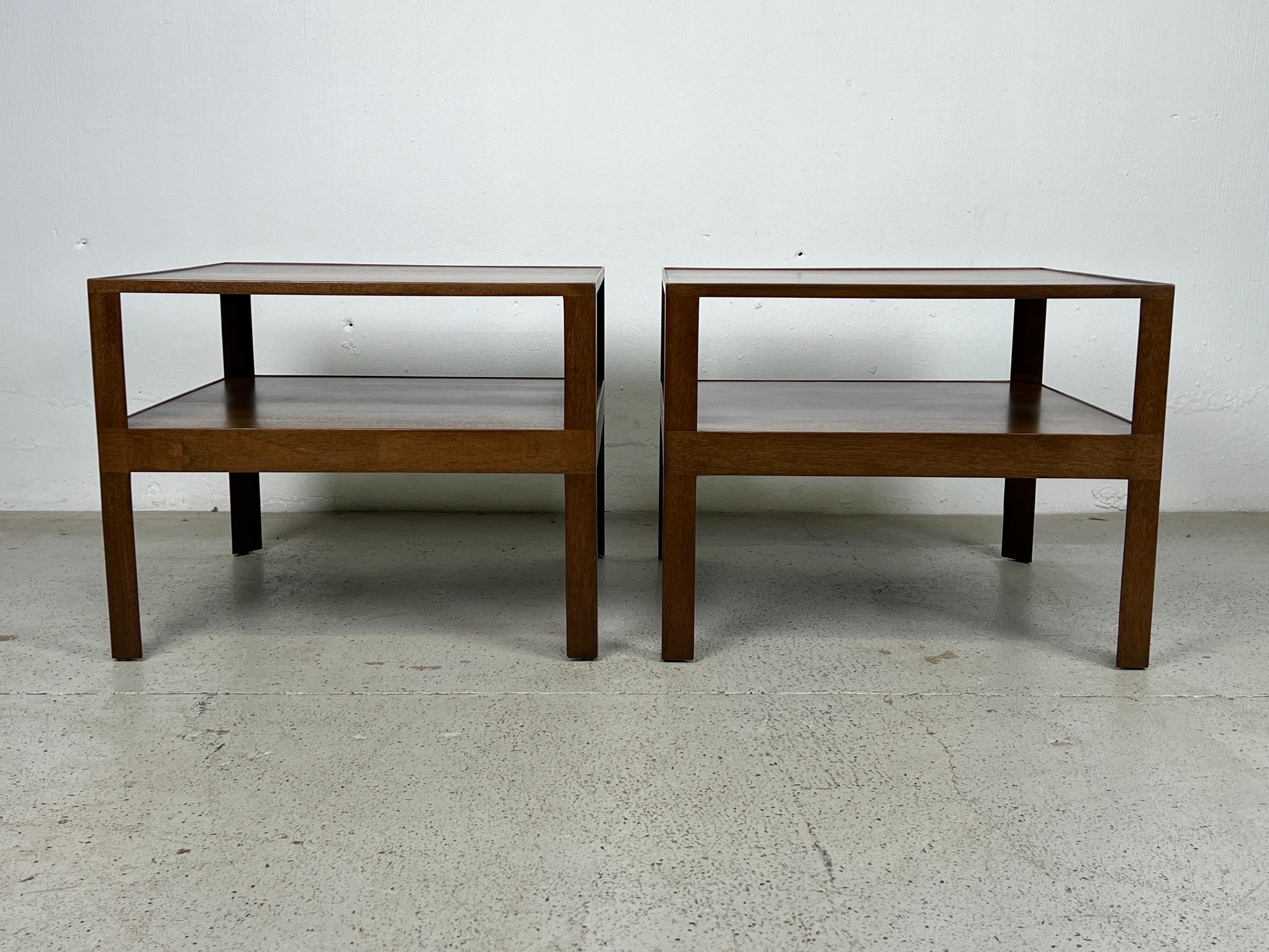 A pair of two tier end tables / nightstands by Edward Wormley for Dunbar. 