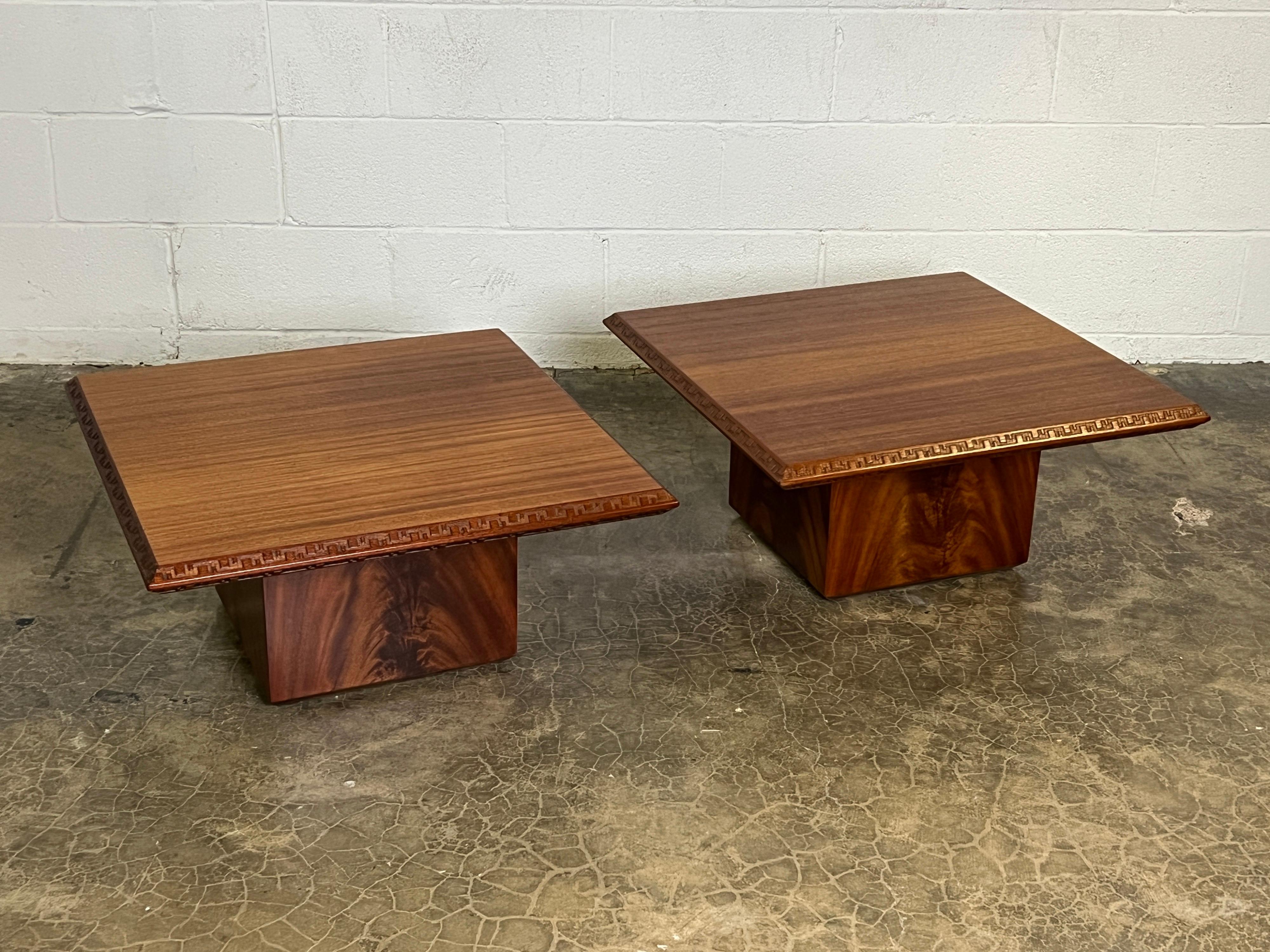 A pair of mahogany tables designed by Frank Lloyd Wright for Henredon.