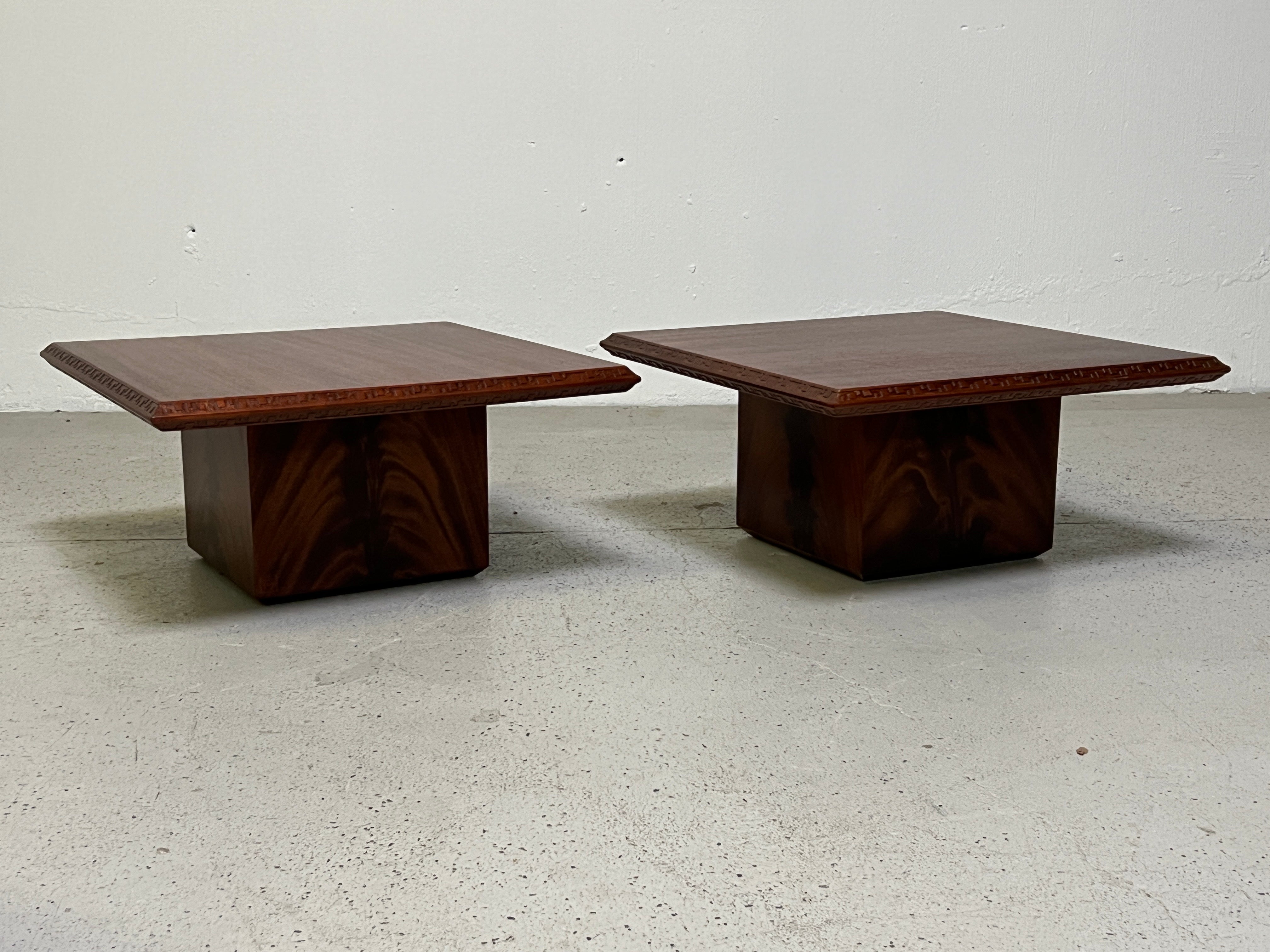 A pair of mahogany tables designed by Frank Lloyd Wright for Henredon.