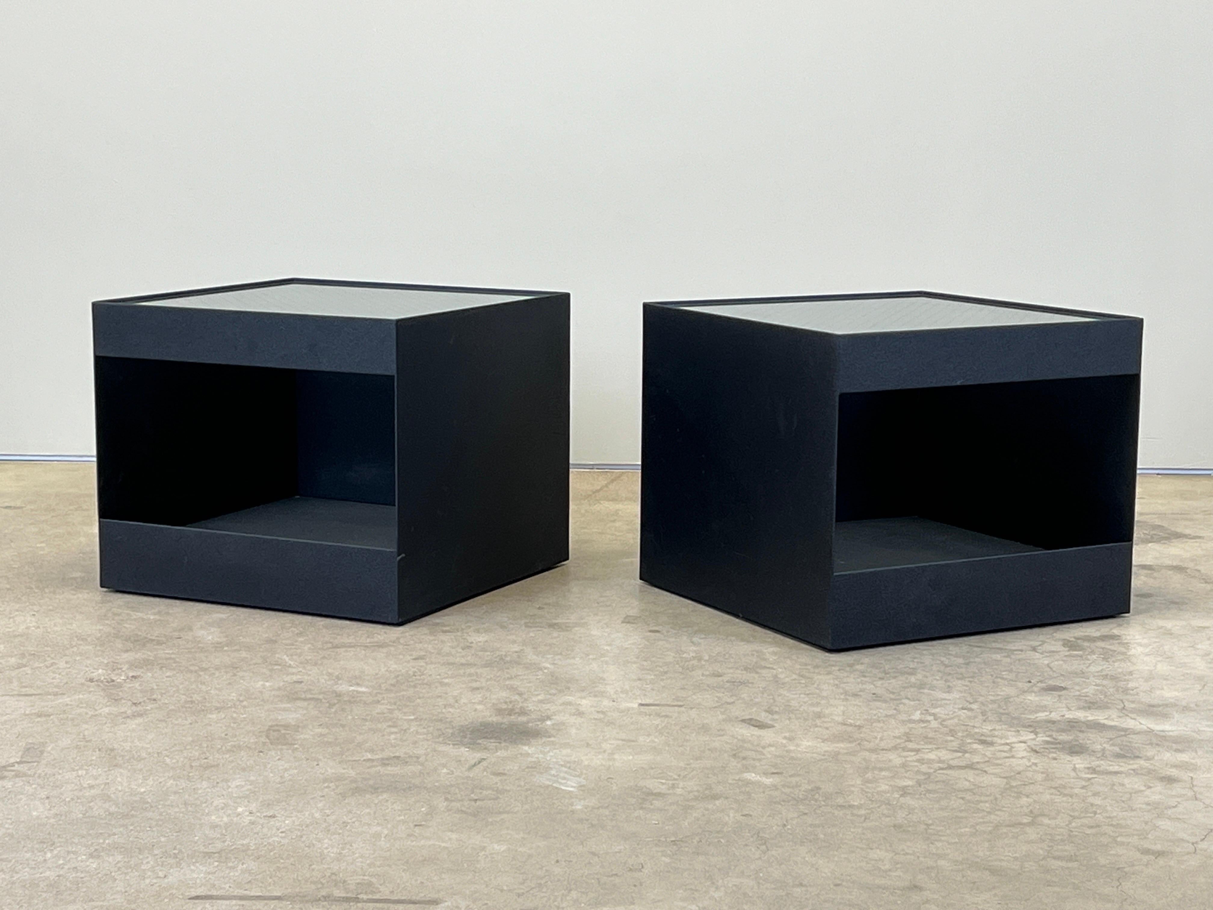 A pair of custom tables designed by Joe D'Urso for Knoll. This unusual pair were custom ordered with a textured black paint. These are all original with safety glass and casters. 
