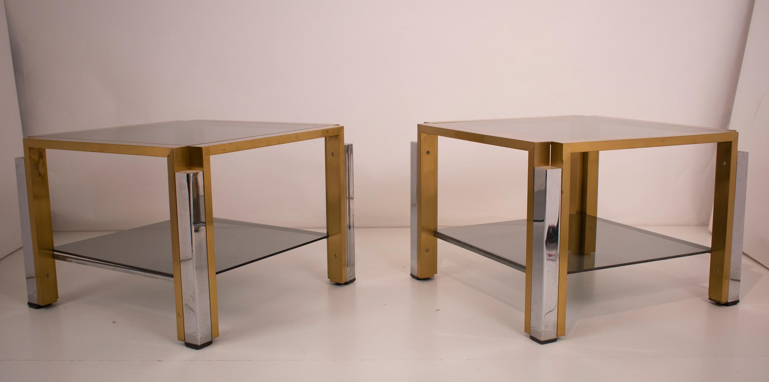 Pair of tables in brass, chromed metal and glass. Spain, 1970s.