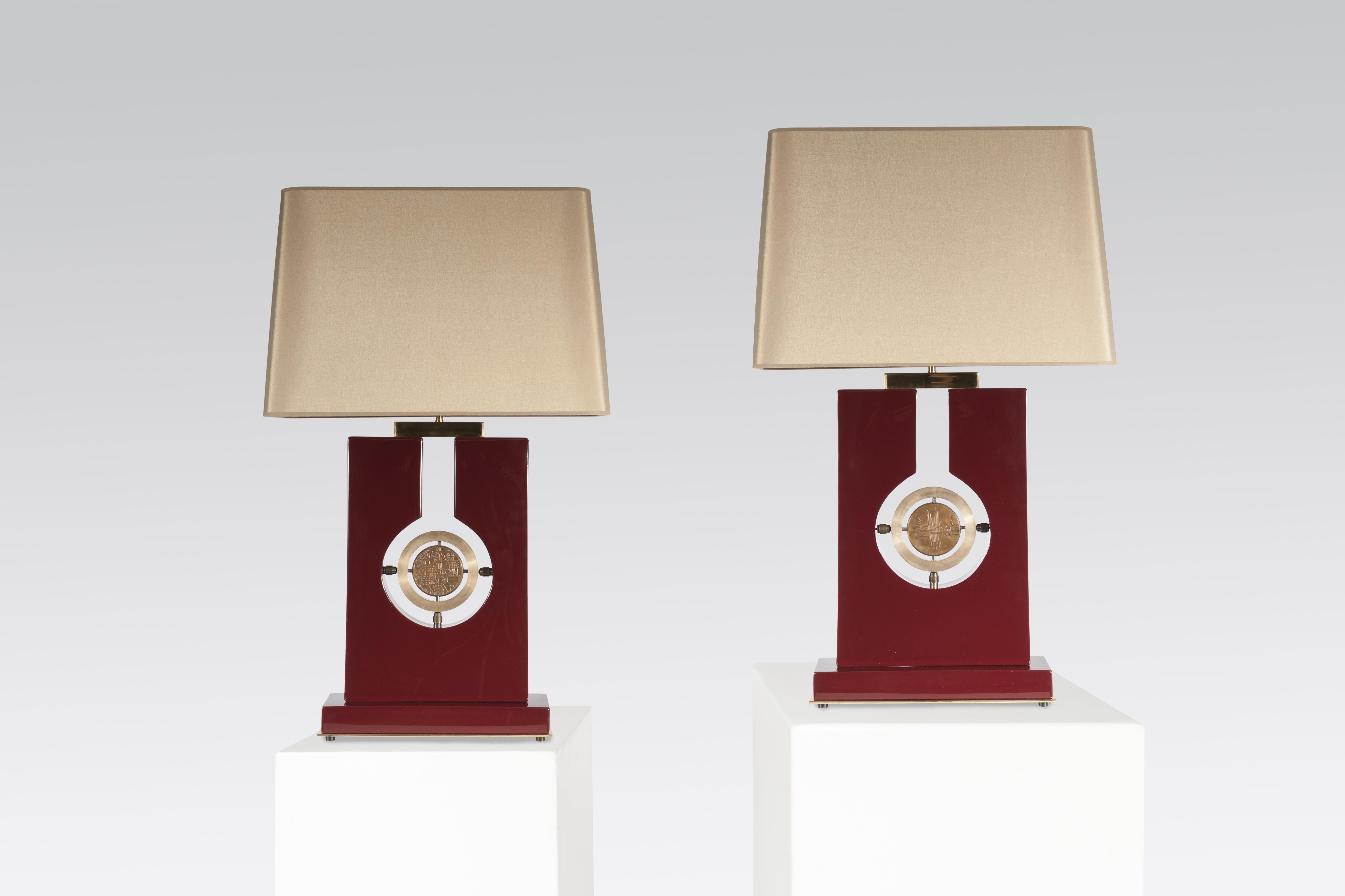 Created to measure by Stan Usel, this pair of burgundy resin, table lamps topped with a medal bronze by Georges Mathieu, a tribute to Georges Mathieu. Each piece is set with a bronze medal and when put together aside gives a great sense of harmony.