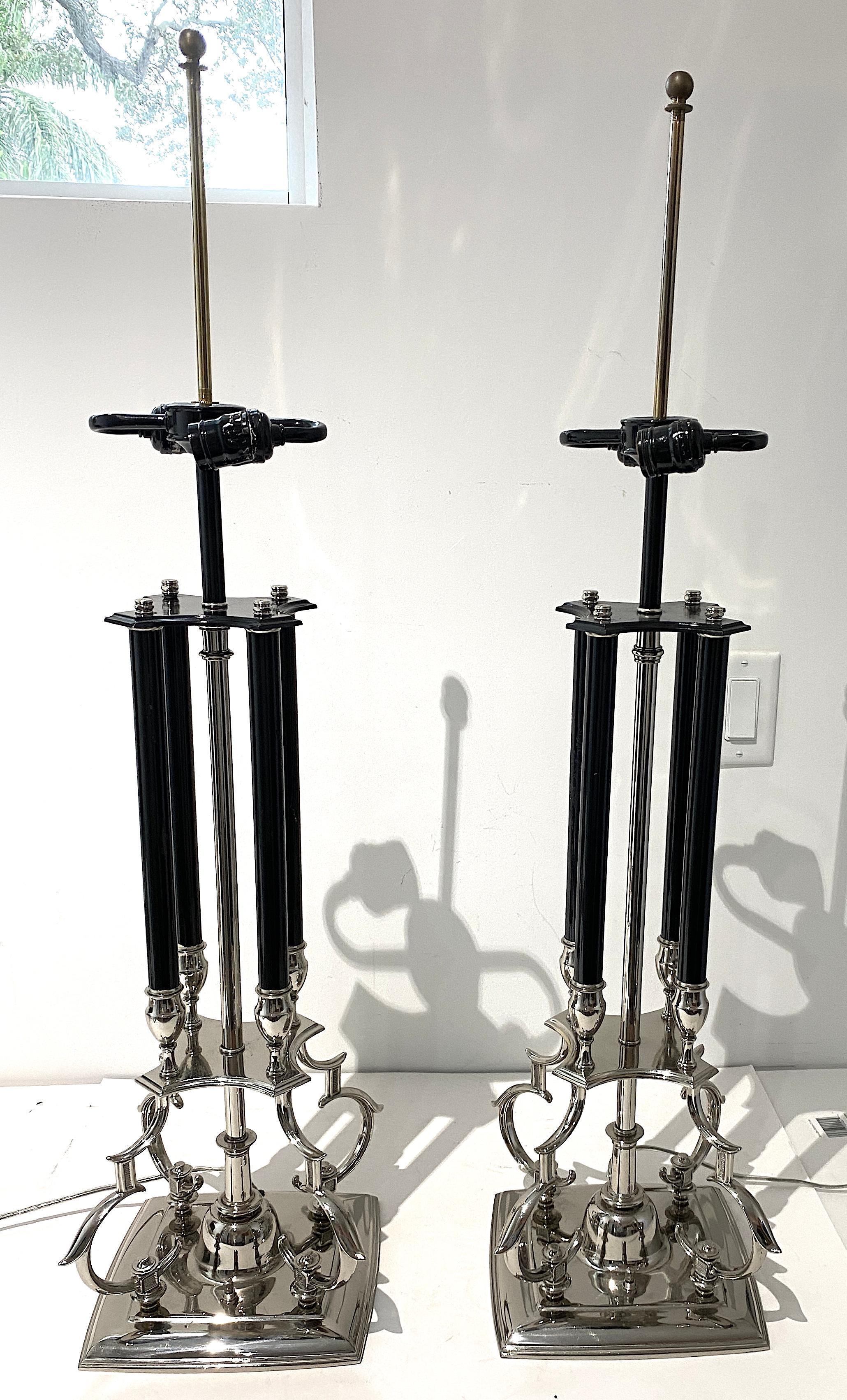 This stylish set of nickel-plated Stiffel table lamps are very much in the style of pieces created by  Tommi Parzinger and they date to the late 1960s to the early 1970s.

Note: Height to top of sockets is 27