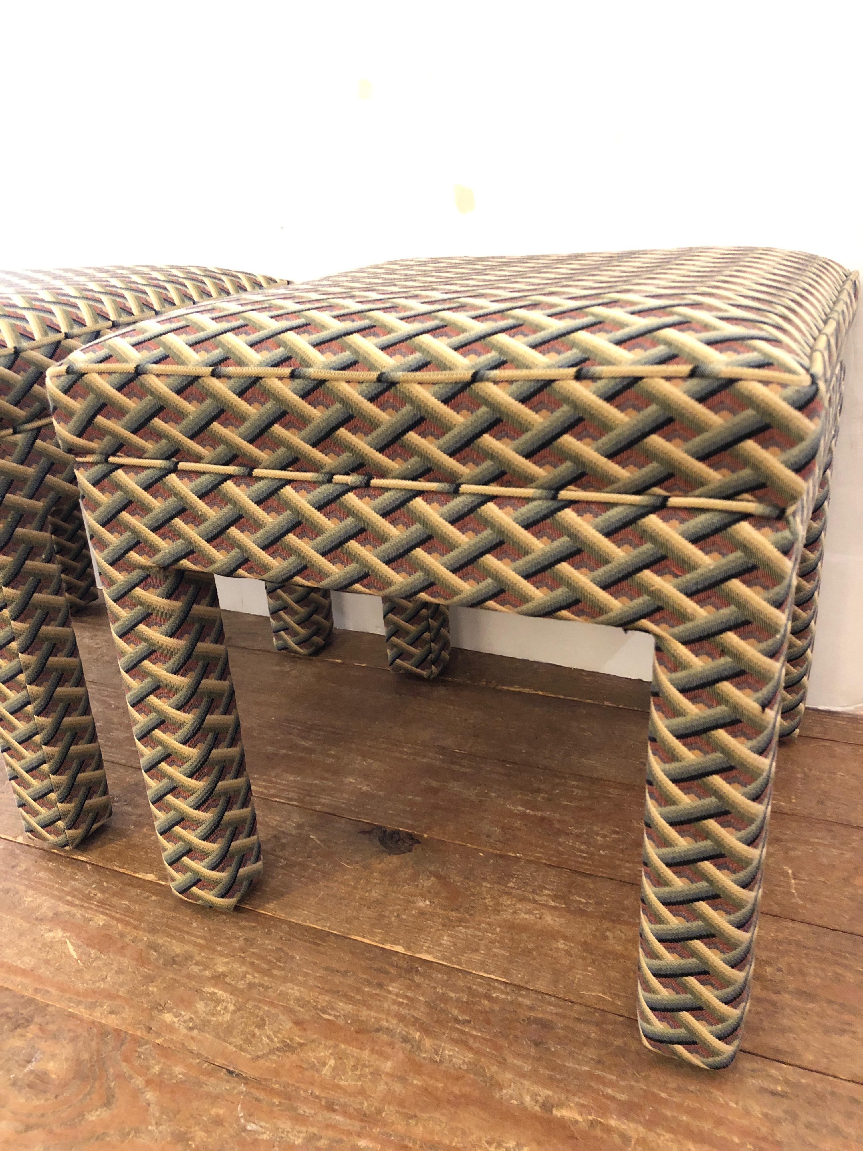 A pair of plush Parsons style Mid-Century Modern upholstered benches or ottomans in a handsome geometric pattern.