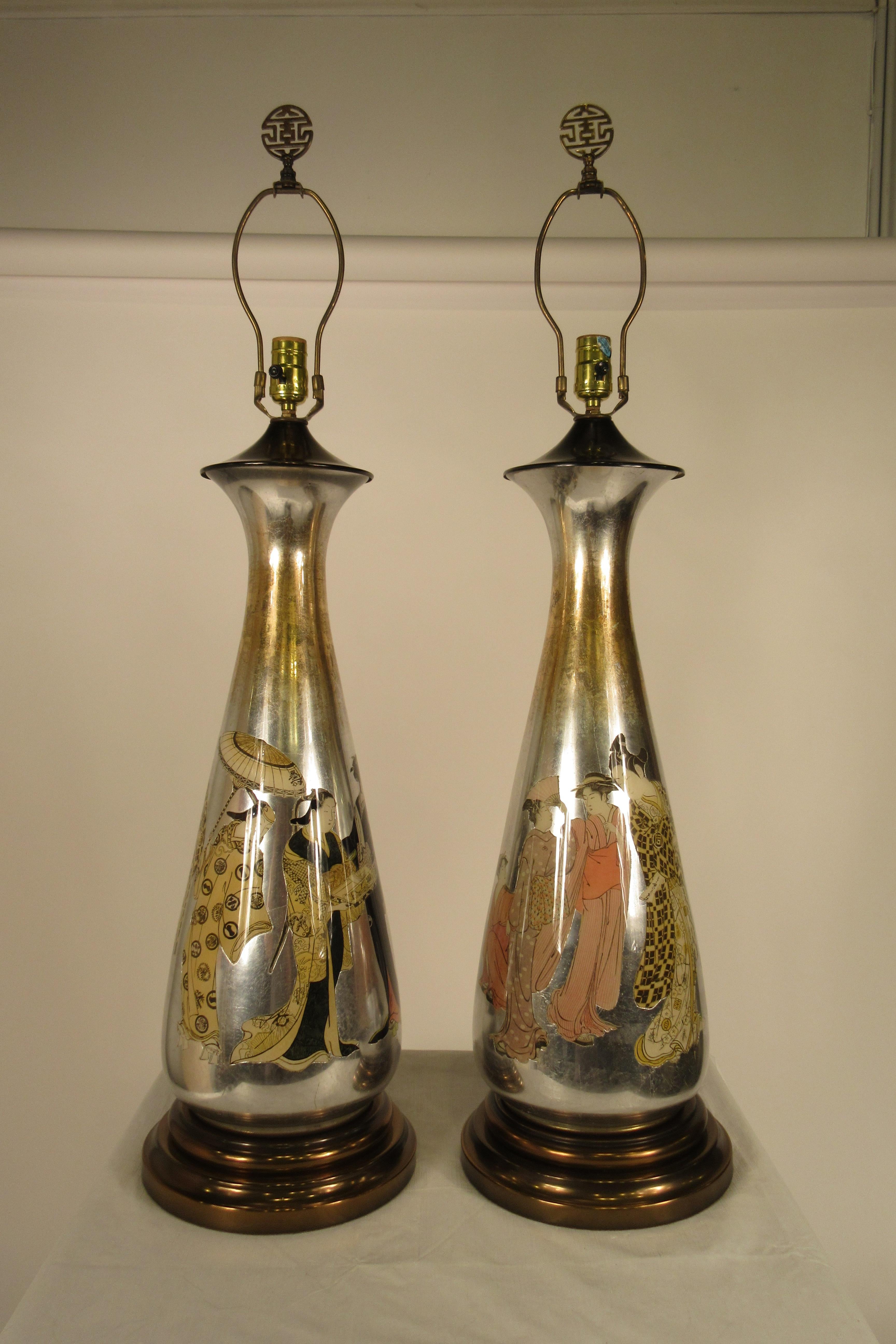 Pair of 1950s tall églomisé silver leaf Asian lamps out of a Scarsdale, NY estate. Lamps have original wiring, needs rewiring.