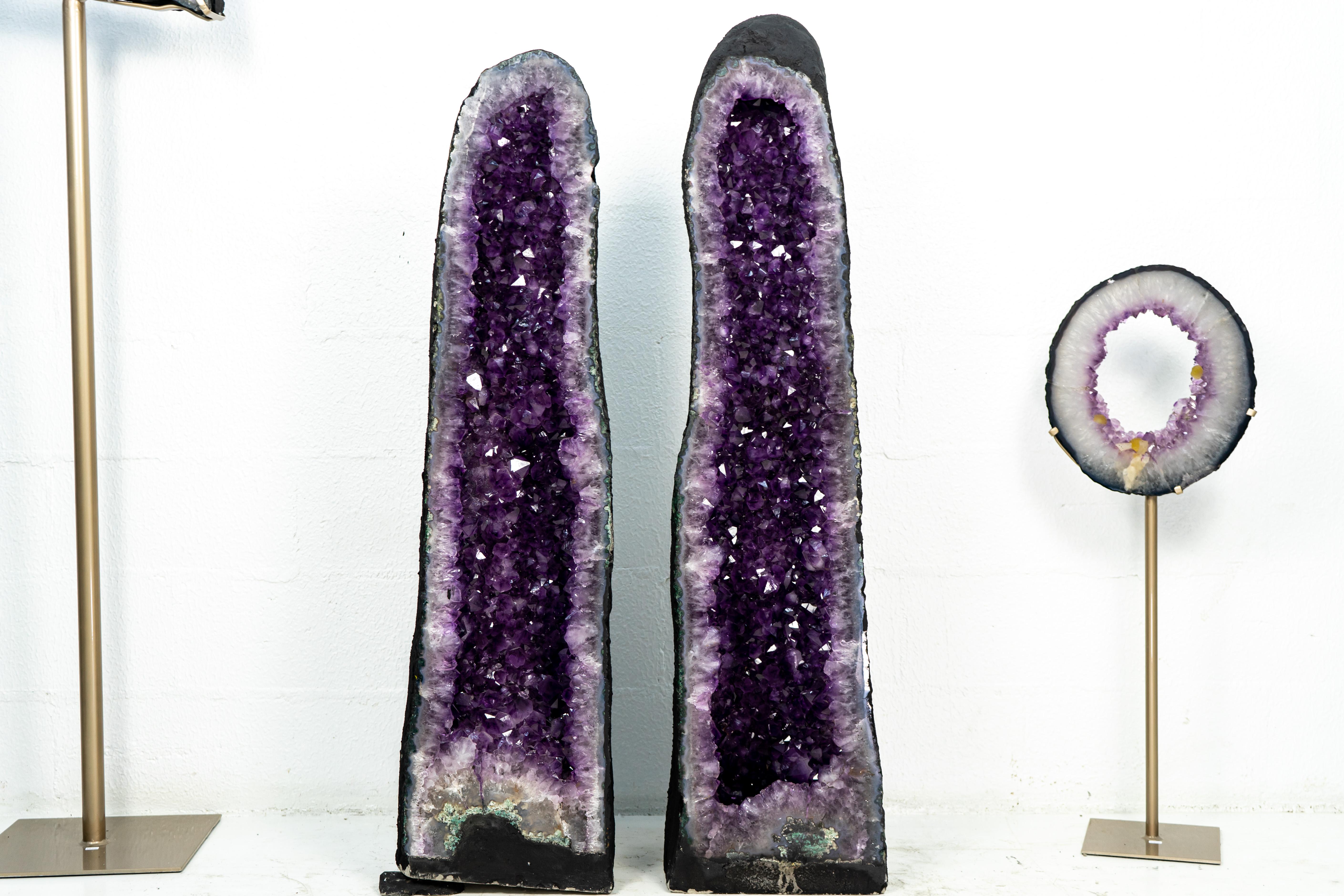 With superb Size, charming aesthetics, large, deep purple Amethyst Druzy, and beautiful characteristics, this book-matching pair of Amethyst Geodes stands at more than 49 Inches tall and is ready to become the central attraction of your home or