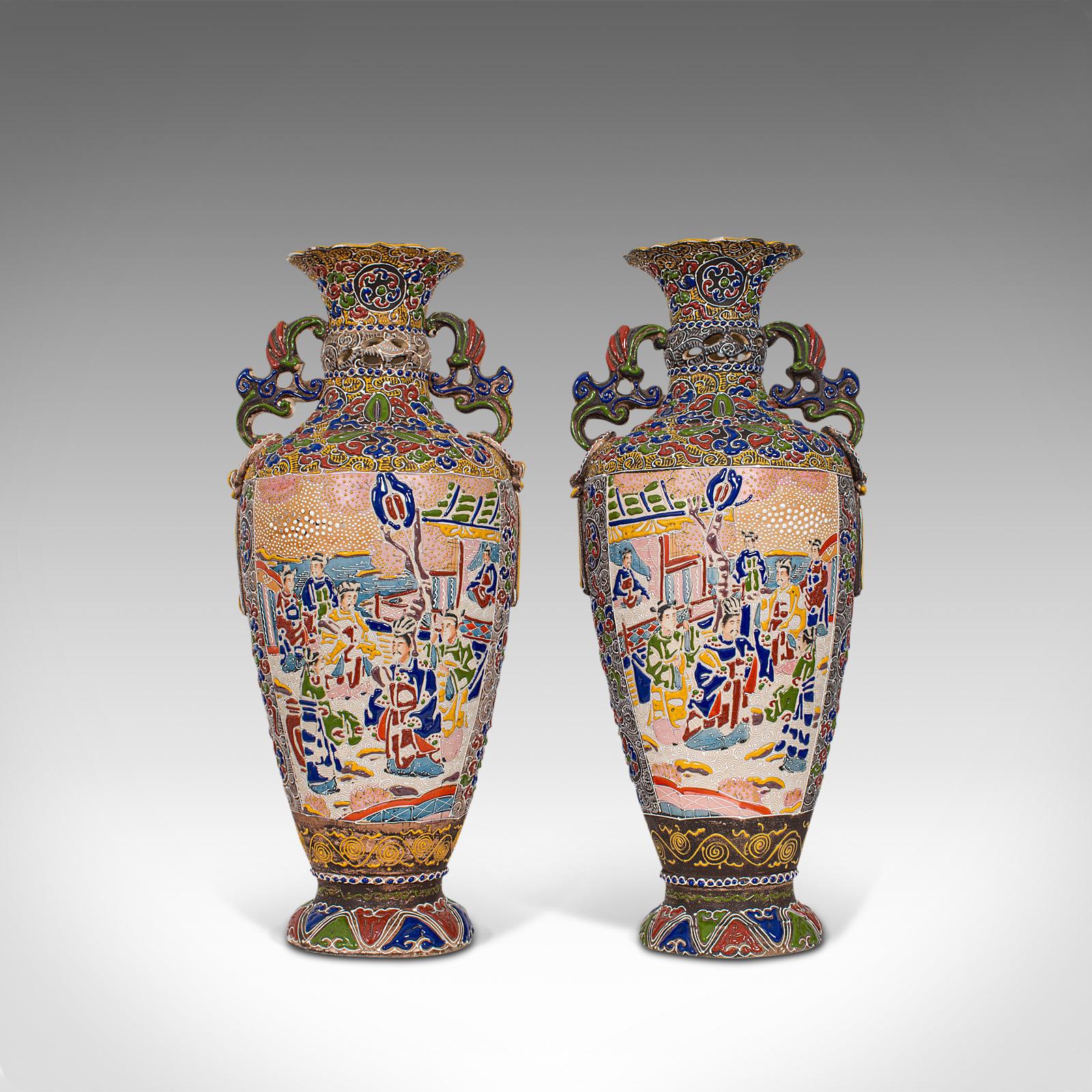 This is a pair of tall antique Satsuma vases. A Japanese, ceramic decorative urn with moriage finish, dating to the late 19th century, circa 1900.

Wonderful, antique Japanese ceramic art
Displaying a desirable aged patina, both in good
