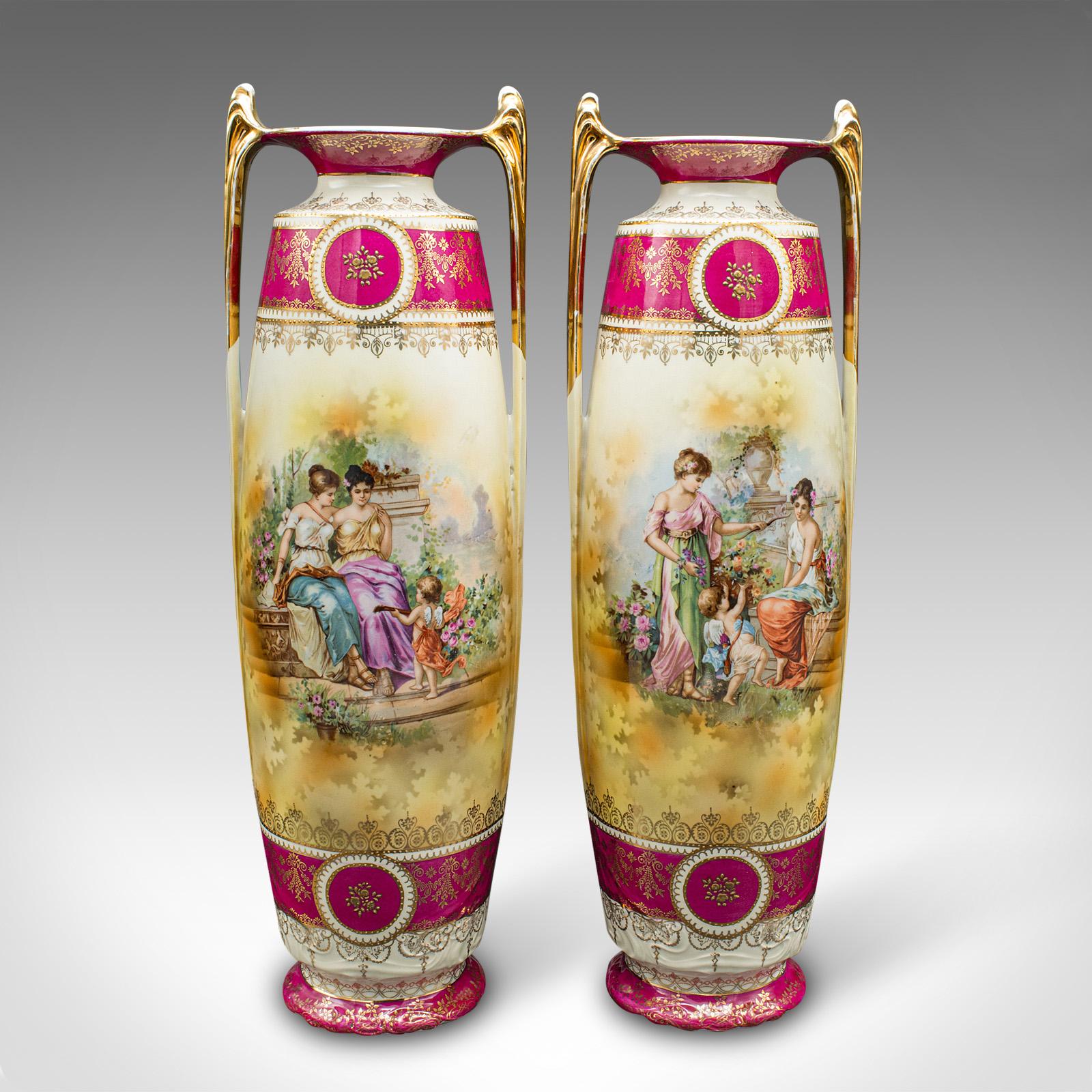 This is a pair of tall antique stem vases. An Austrian, ceramic flower sleeve, dating to the early Victorian period, circa 1850.

Beautifully decorated vases, with superb colour and figural scenes
Displaying a desirable aged patina and in good