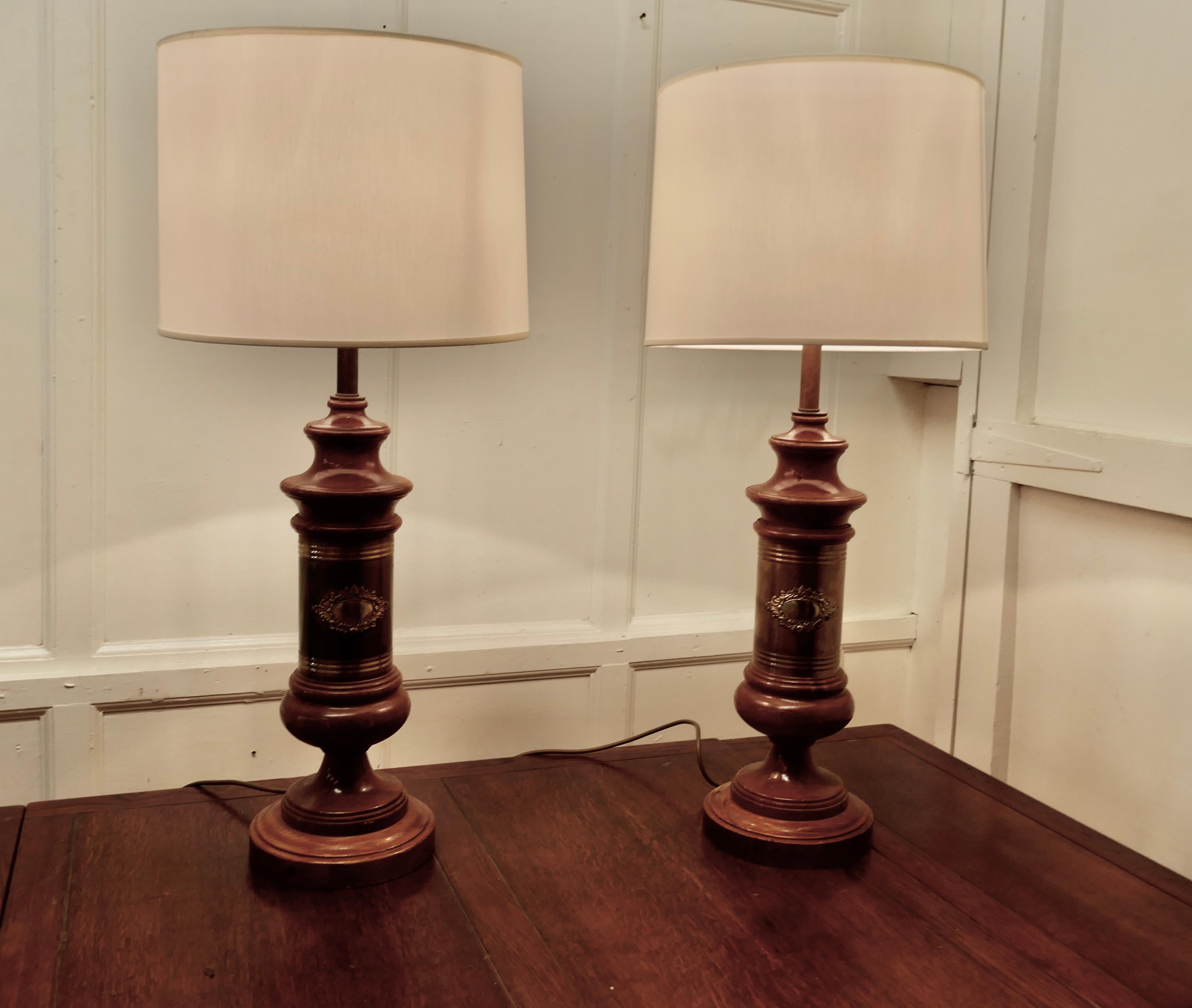 Pair of tall Art Deco style column table lamps

These are a very stylish pair of column lamps
The main columns are in walnut and they each have a presentation plaque on the front, these have not been engraved
These very tall lamps come with