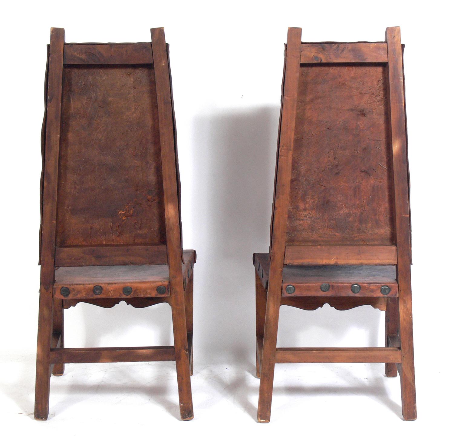 Pair of Tall Back Mexican Leather Chairs In Distressed Condition In Atlanta, GA