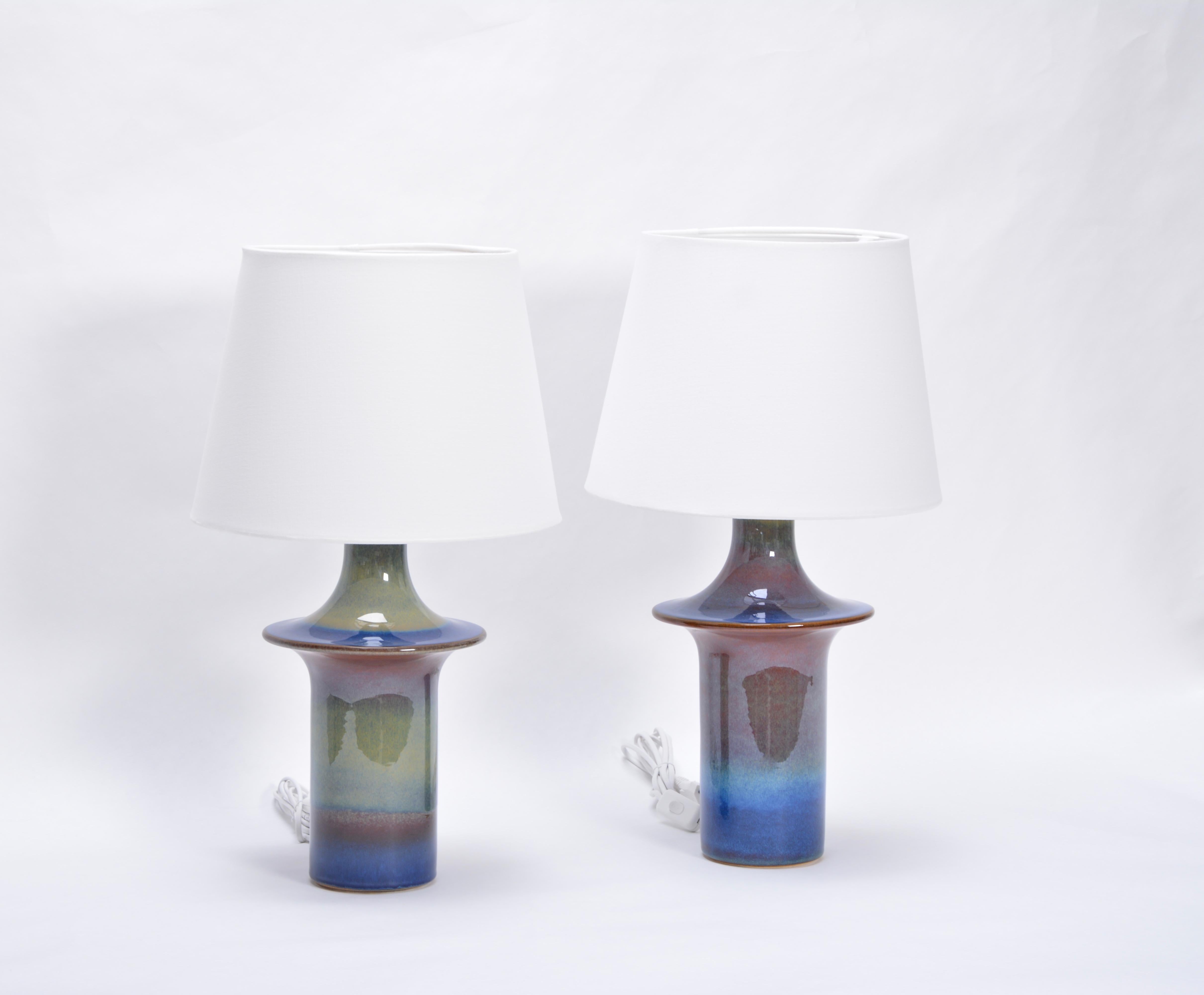 Pair of ceramic table lamps with beautiful glazing in different blue tones produced by Danish company Soholm Stentoj. The lamps have been rewired for European use and have new shades. To be checked by a local electrician before put to use.
Søholm