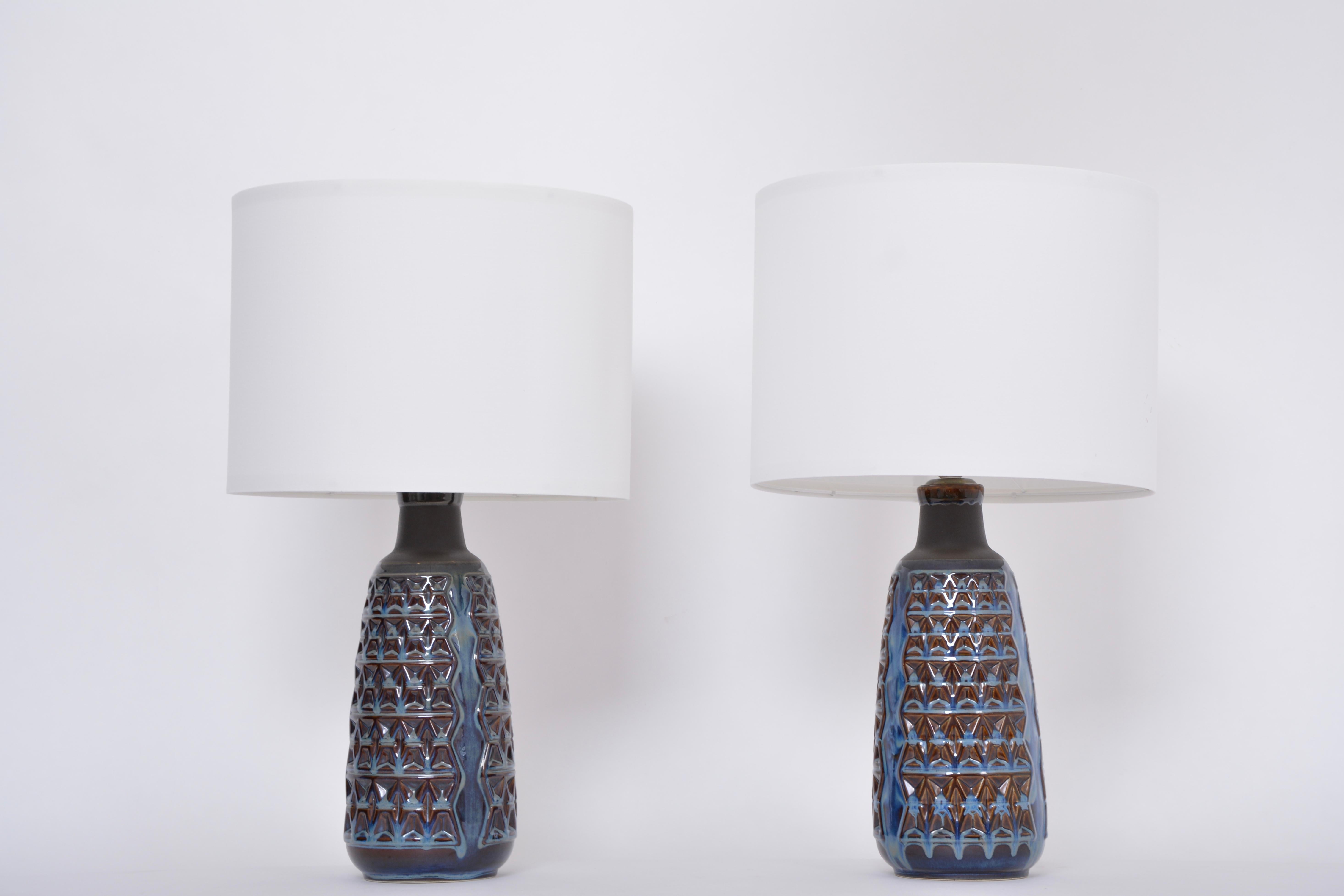 Pair of Tall Blue Mid-Century Modern Table Lamps model 3340 by Einar Johansen for Soholm
These table lamps were originally vases that have been converted into spectacular and impressive table lamps. Einar Johansen designed these vases for Danish