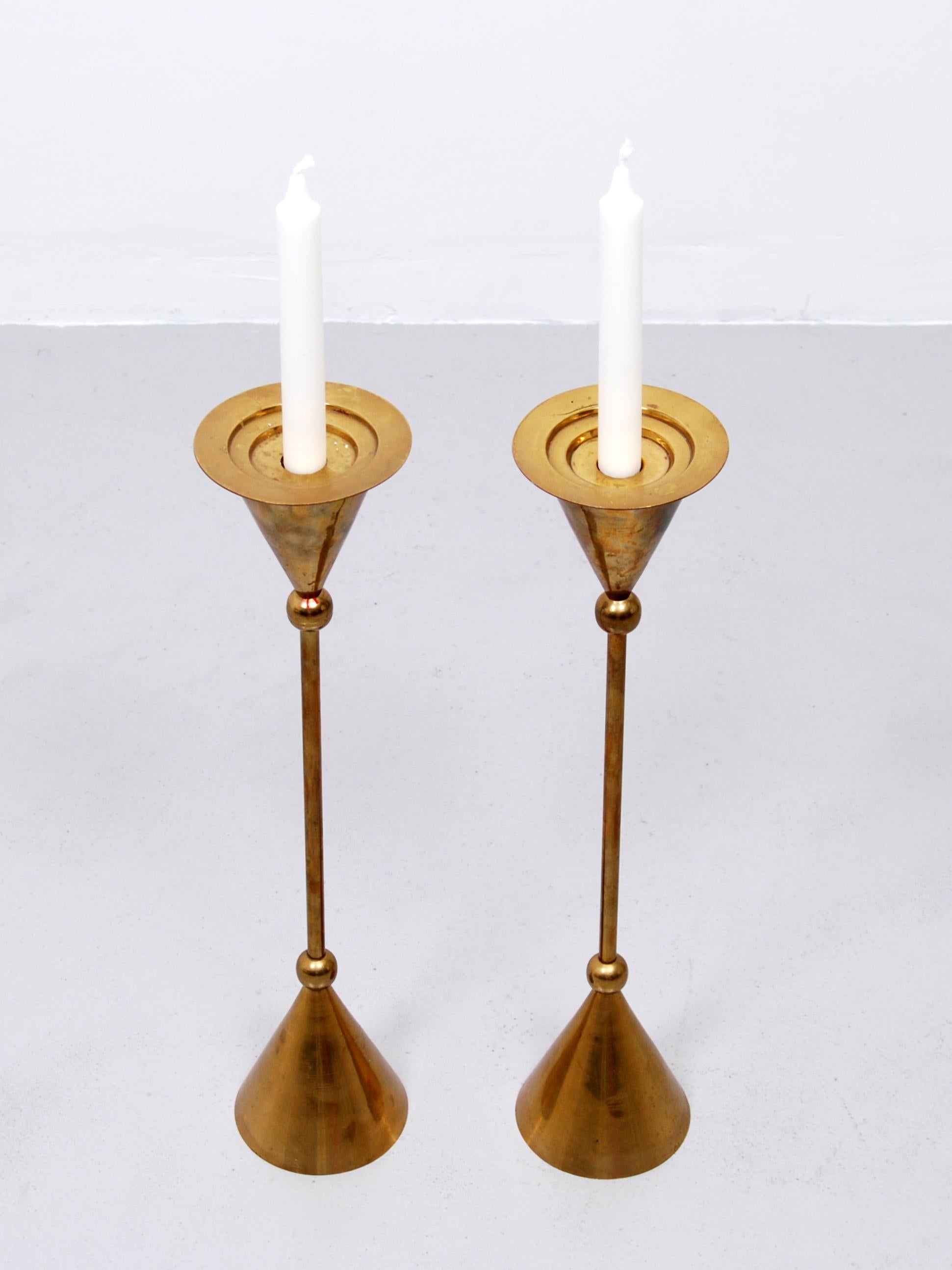 Beautiful vintage midcentury brass floor candle holders or stands with a cone and ball design.
 