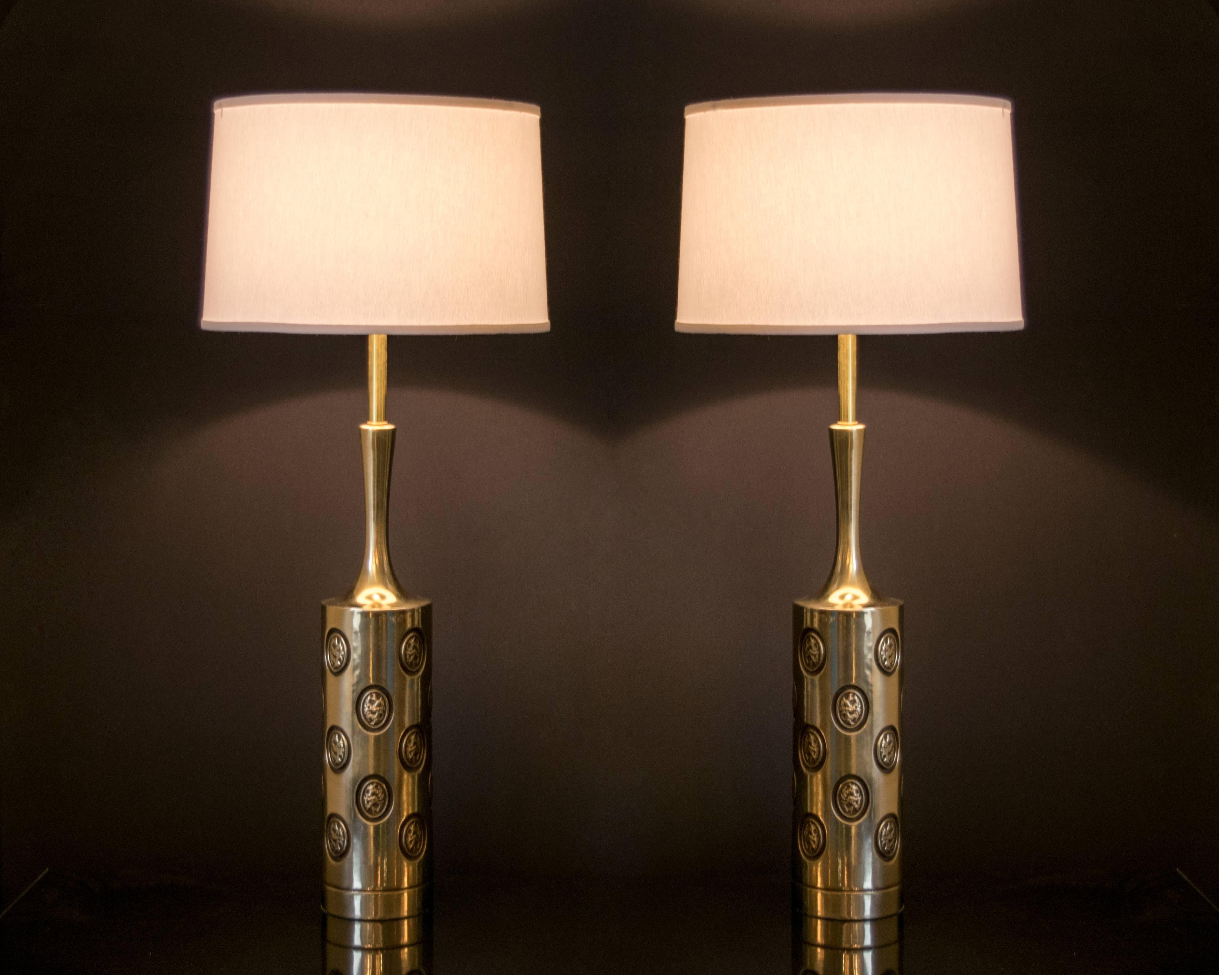 An elegant pair of vintage Rembrandt brass lamps with coin inlays detailed with black lacquer. Excellent condition, recently re-wired.
