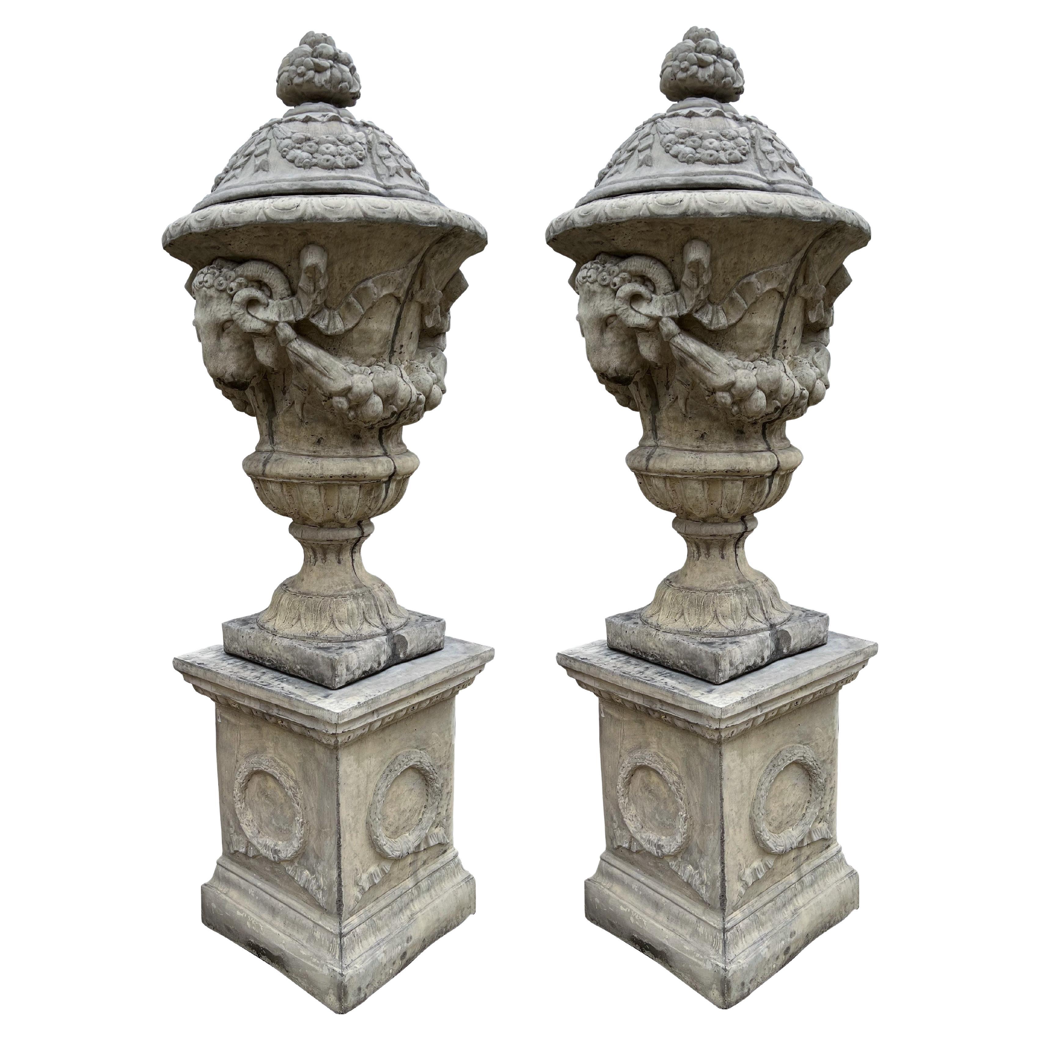Pair of Tall Cast Garden Urns on Pedestals with Rams Heads and Swags