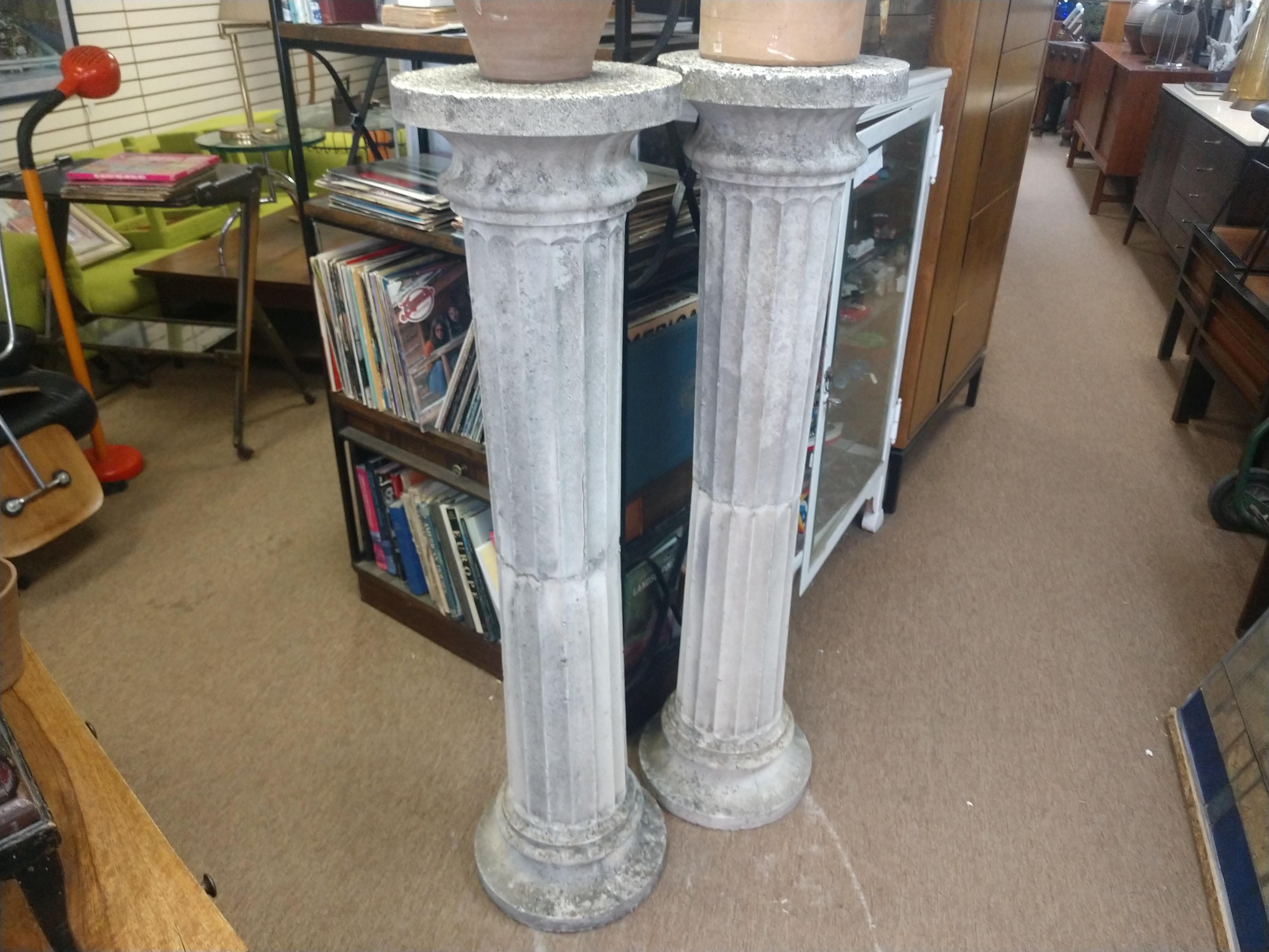 Pair of fabulous and heavy fluted pedestals, 53.5 inches tall. A very dramatic style, Greco-Roman, almost 14 inches in diameter at the base and top. Great for a large planter or simply stand by themselves, architectural art.