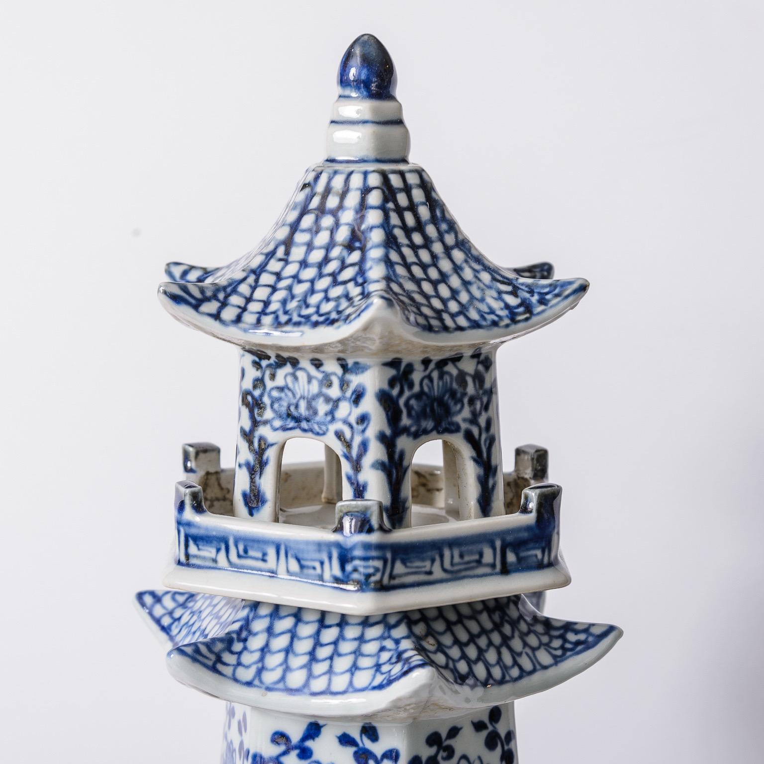Just in, this pair of tall Blue and White  porcelain pagoda towers each crafted with six hand decorated separate pieces.
These are in separated pieces to facilitated shipping.
Very good vintage condition, consistent with age and use.