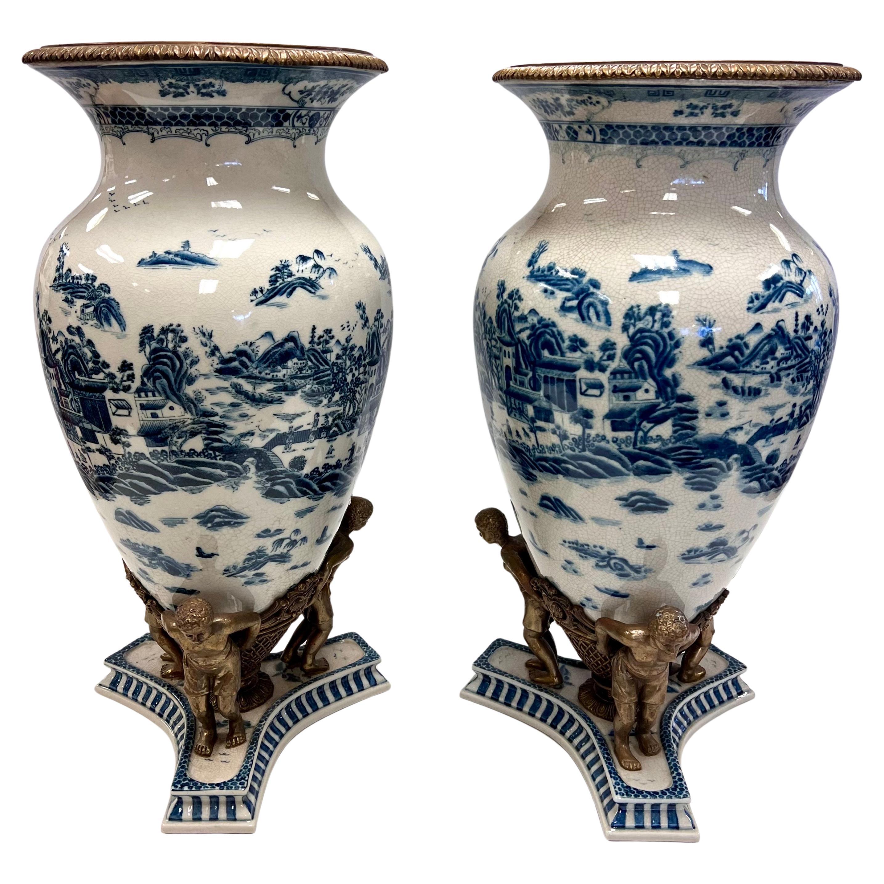 Pair of Tall Chinoiserie Blue and White Urns With Bronze Figural Mounts For Sale