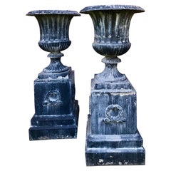Pair of Tall Classical Styled Fluted Metal Garden Urns on Stands