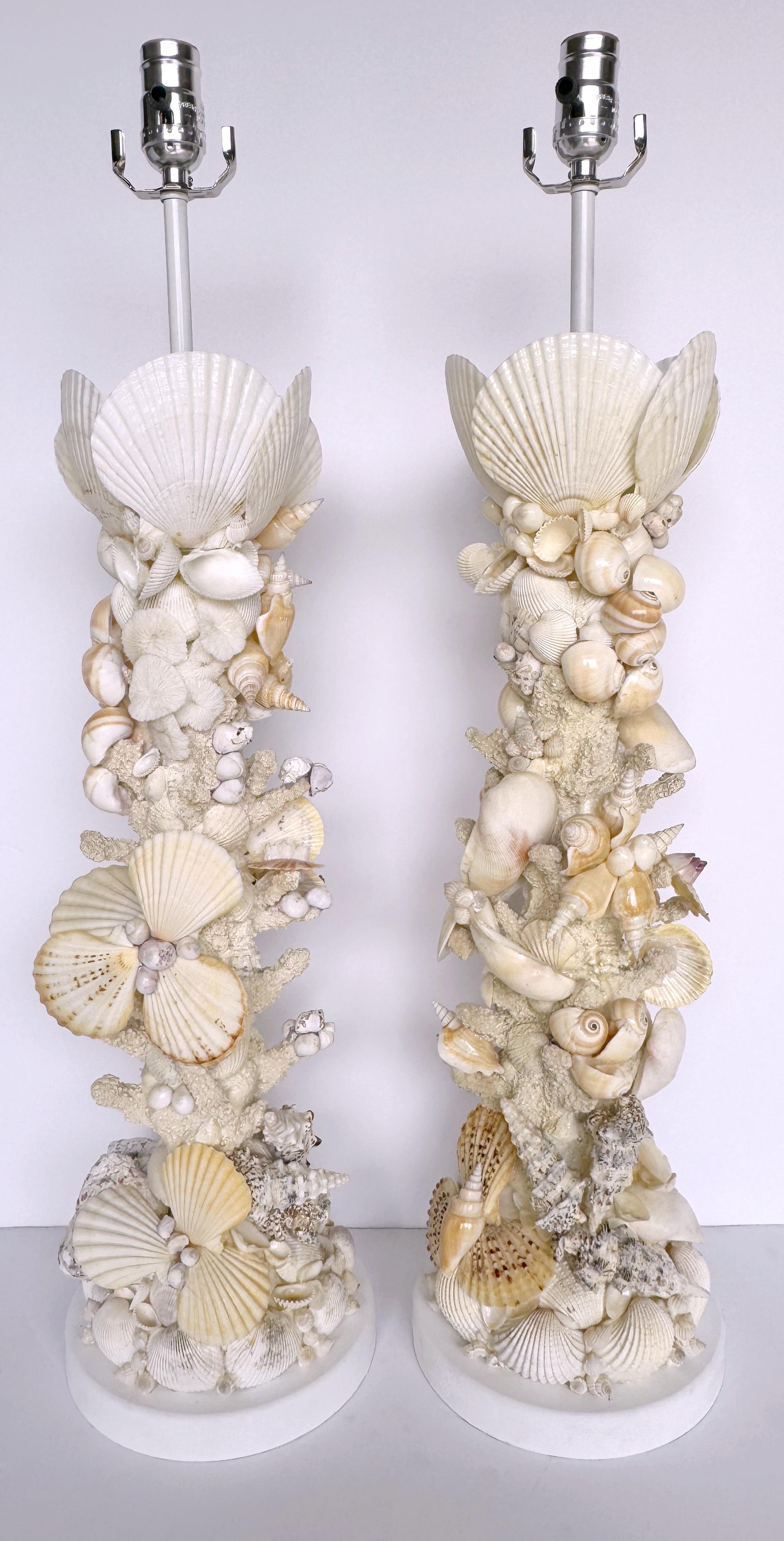 Pair of Tall Coastal Seashell Encrusted Column Lamps
USA, Later 20th Century 

A stunning pair of tall coastal seashell-encrusted column lamps. Made in the USA during the late 20th century, these lamps are a testament to organic seaside aesthetics