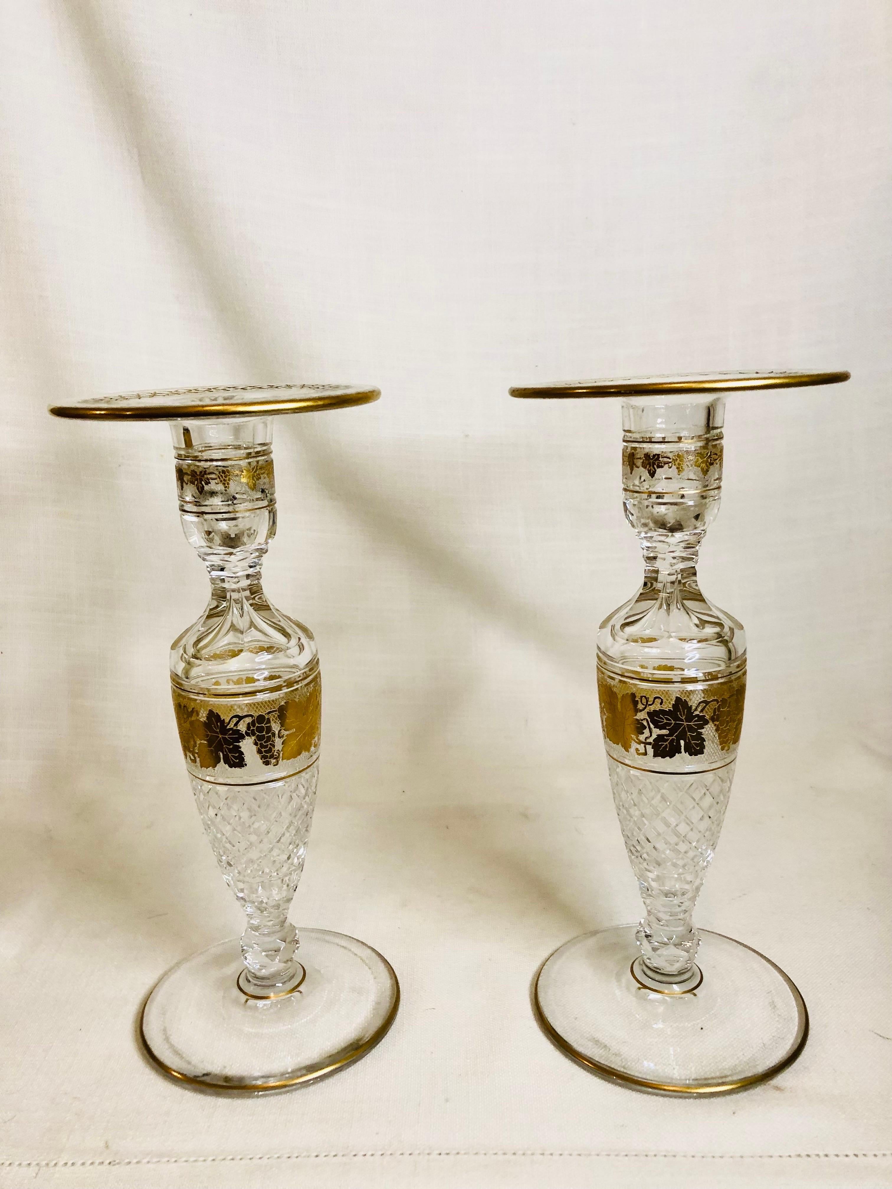 I am offering you this beautiful cut crystal pair of Val Saint Lambert candlesticks with decorations of gilt grapes and grape leaves from Belgium. The bases of the candlesticks are beautifully cut as you can see in the pictures. These stunning Val