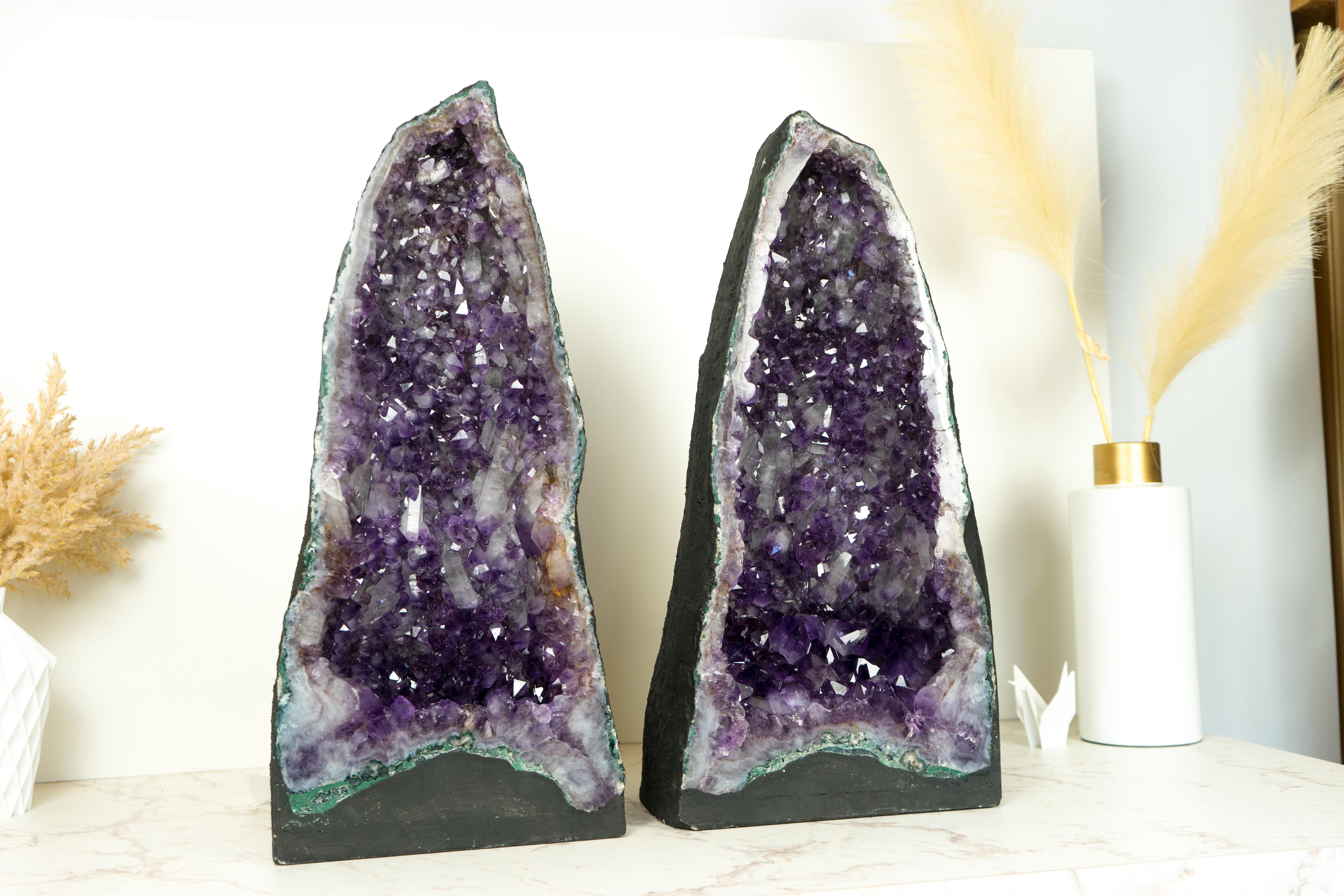 With its many qualities, including the rare Amethyst Druzy and its beautiful formation, this pair of magnificent Amethyst Geode Cathedrals is sure to add a pop of violet-purple color and a calming, peaceful atmosphere to your decor or crystal