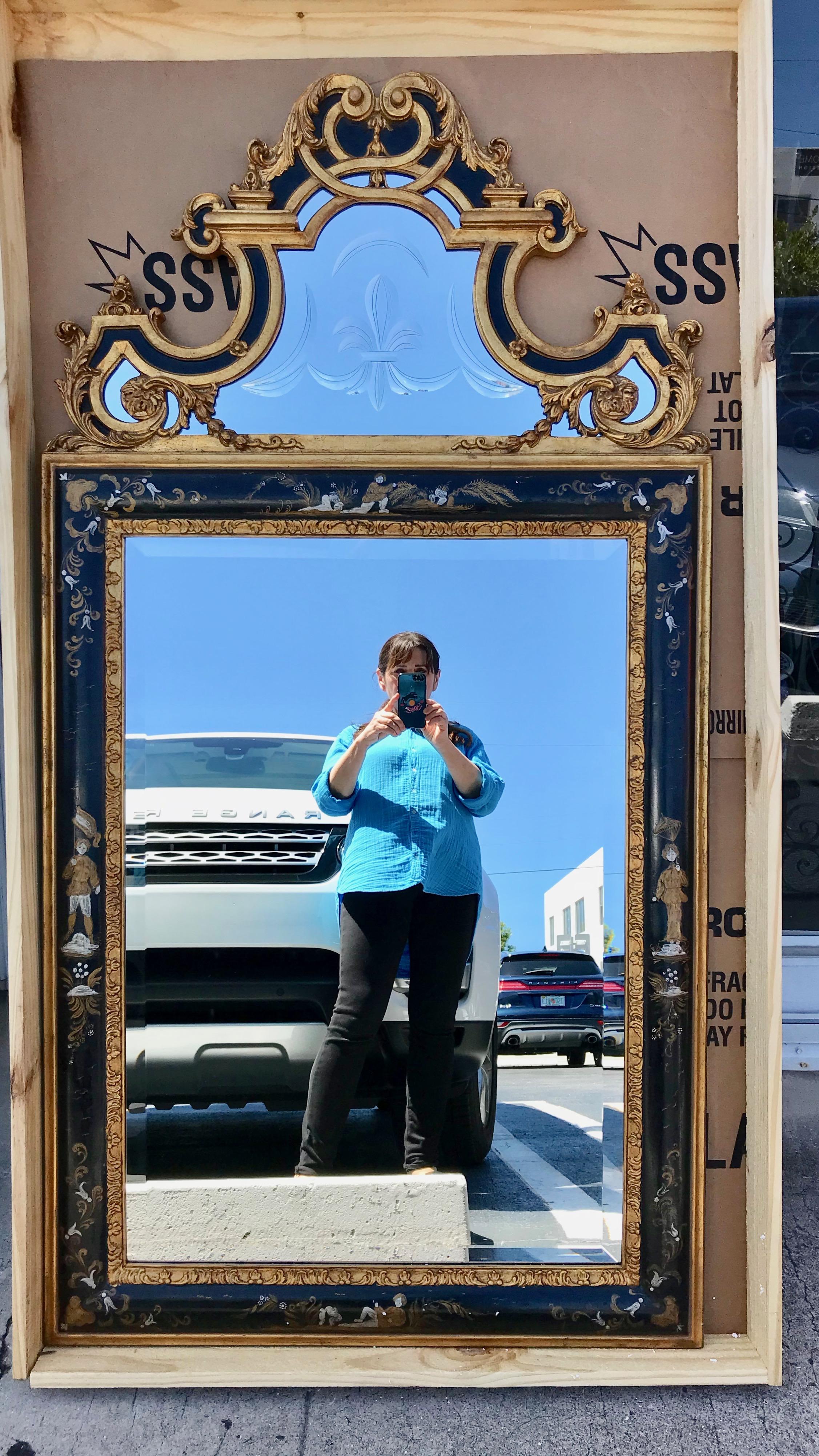 Fine Regency style mirrors with elaborate crowns inset with fabulous Fleur de Lis etched glass and gilt appointments. The frames are painted with figures and flora surrounding the bevelled glass. Superior chinoiserie design.
The mirrors are