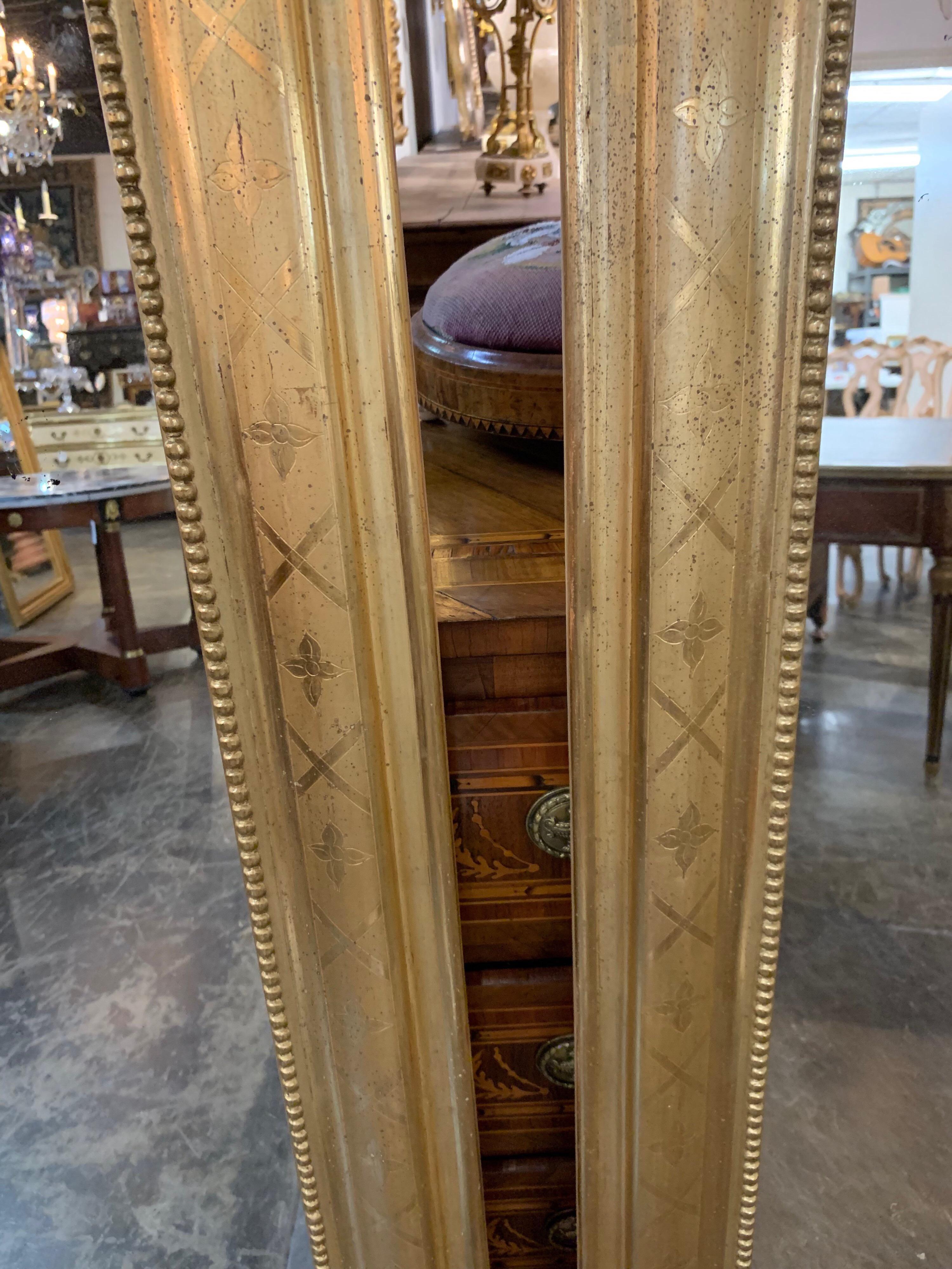 Beautiful pair of tall Louis Philippe gold gilded mirrors with X pattern. There is a beaded detail on the inside border. Original wood on the back of the mirrors. A very elegant pair for a fine home! Perfect for todays mix of modern with fine