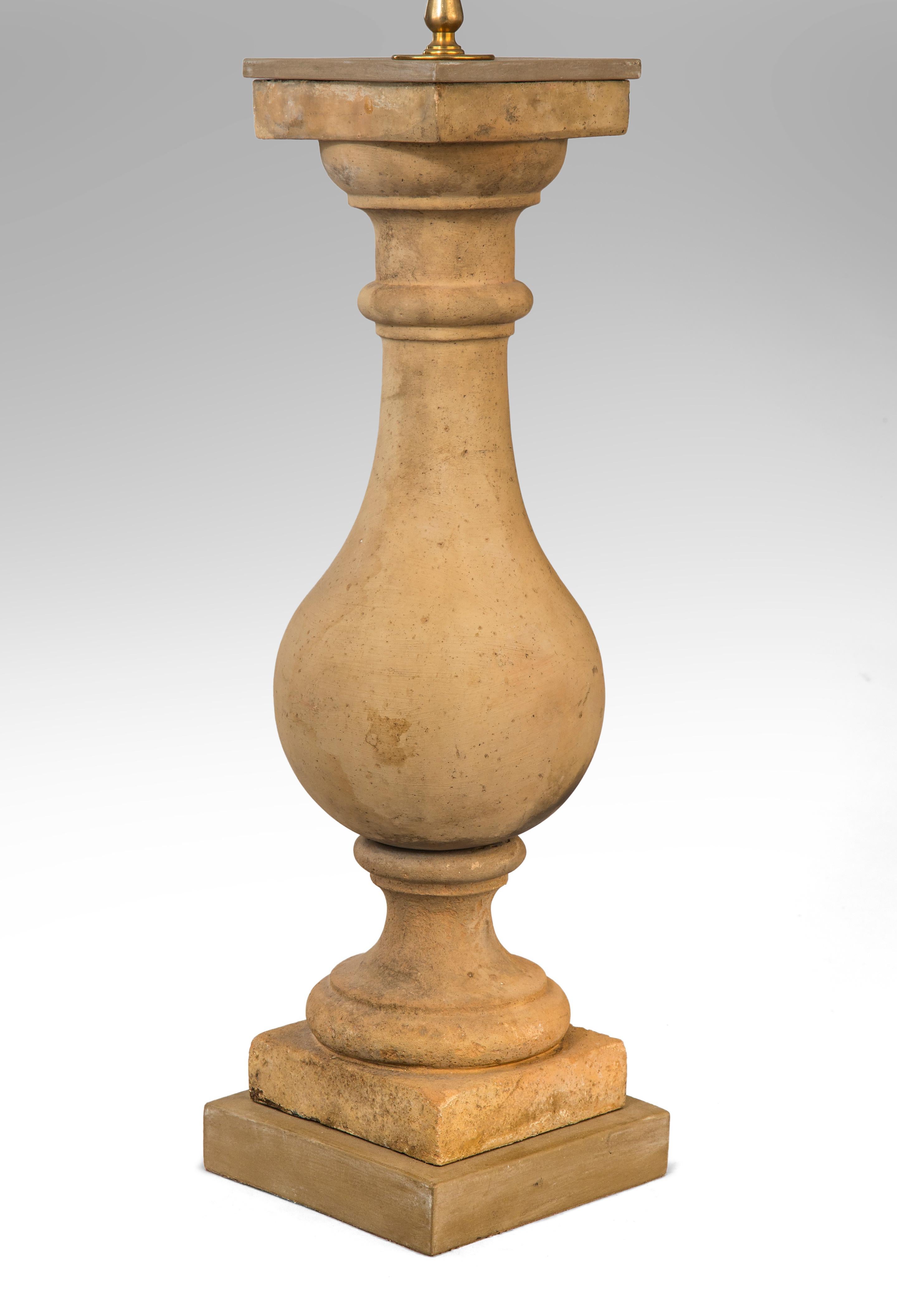 A pair of tall French neoclassical terracotta Baluster lamps
19th century
Great looking lamps of beautiful proportion and color. Each with a generously scaled baluster standard resting on a socle above a square base. Shades included.
Height of