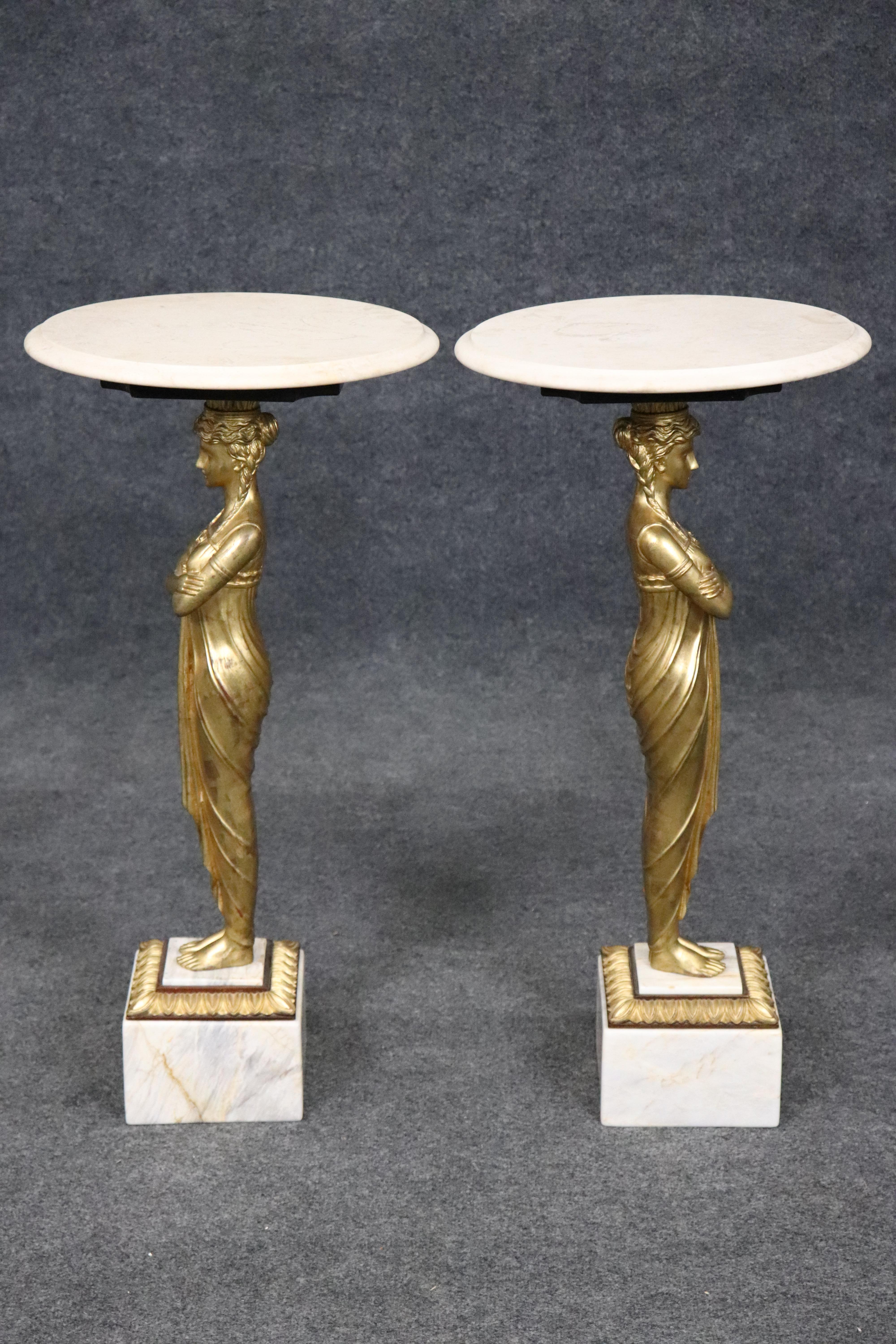 This is a stunning pair of gilded maidens supporting marble tops with marble on each base. The tables are luminous and in good condition with minor signs of age and use but nothing significant to speak of. The carved figures are absolutely gorgeous