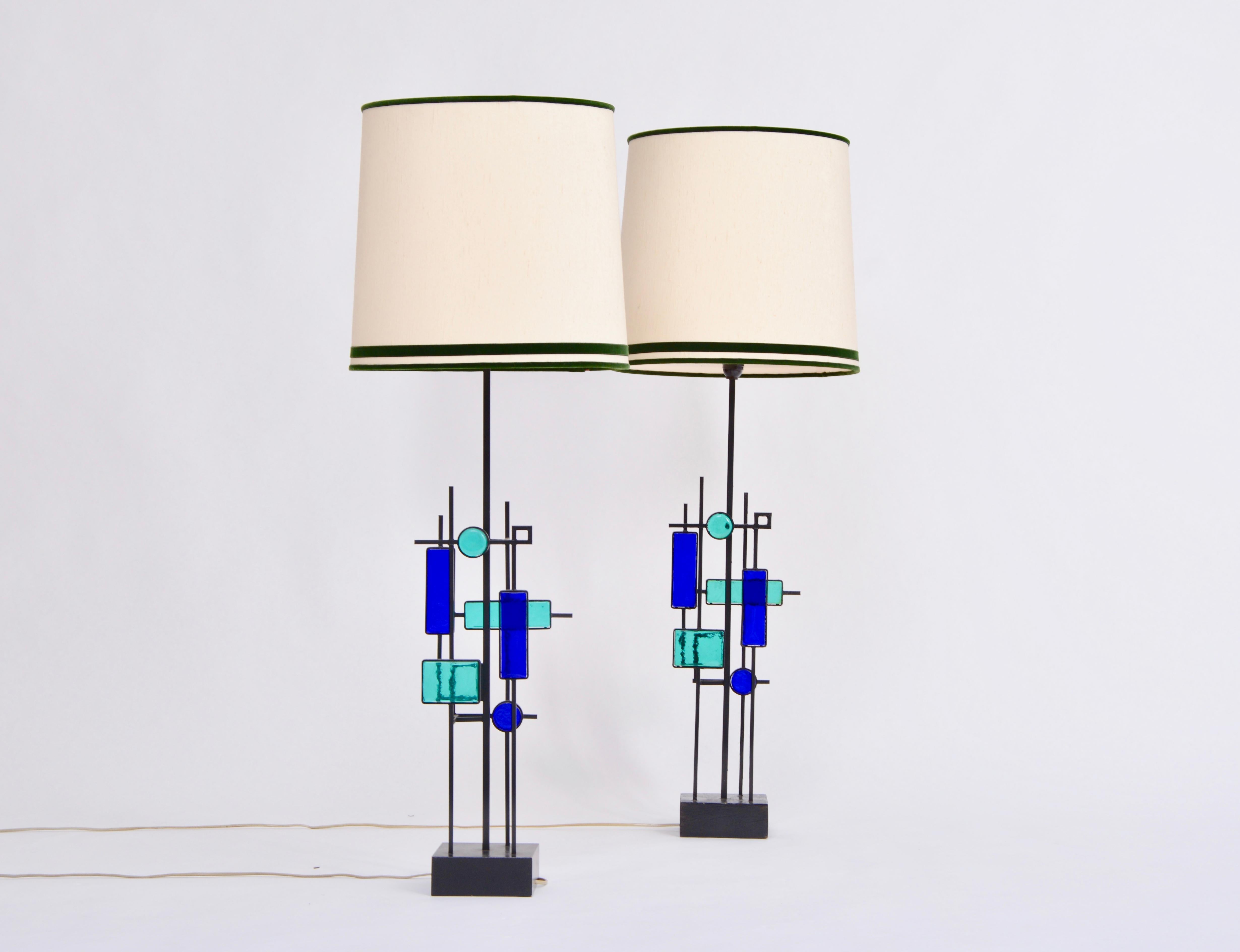 Pair of Tall Mid-Century Modern Iron and Glass Table Lamps by Svend Aage Holm Sorensen
Gorgeous pair of table lamps made of black lacquered iron and colored glass designed by Svend Aage Holm Sorensen and produced by Holm Sørensen & Co. in the