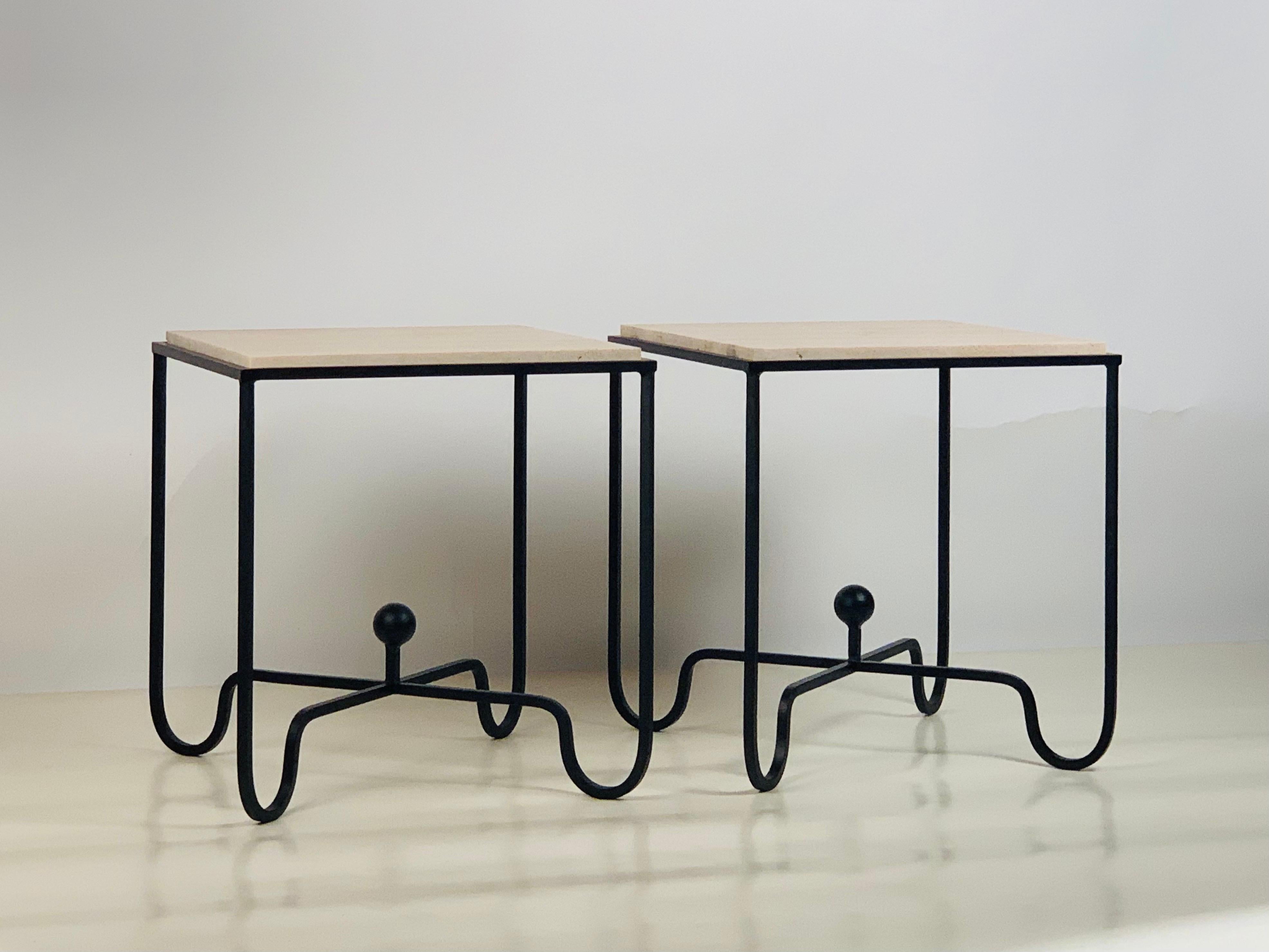 Pair of tall blackened iron and unfilled travertine 'Entretoise' side or end tables by Design Frères.

Also great when an understated pair of nightstands is desired.