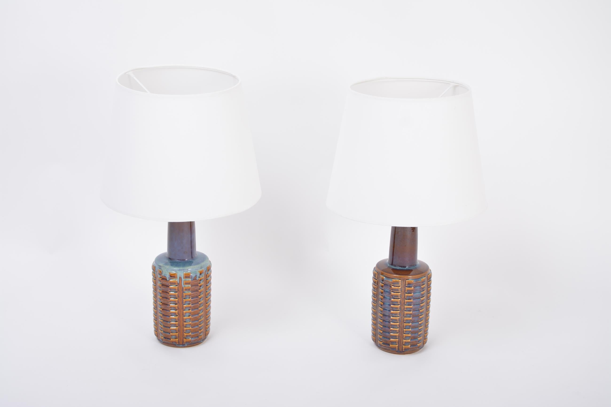 Pair of Tall Mid-Century Modern Ceramic Table Lamps by Einar Johansen for Soholm
This pair of ceramic table lamps was designed by Einar Johansen and produced by Soholm Stentoj in Denmark in the 1960s. The lamps have been rewired with switches and