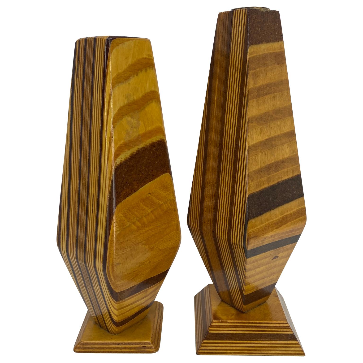 Mid-Century Modern tall and handsome wood inlay candleholders. This pair has one candleholder slightly taller than the other and both are striking with several wood inlays. Each candleholder has a felt bottom to protect surface and are striking in