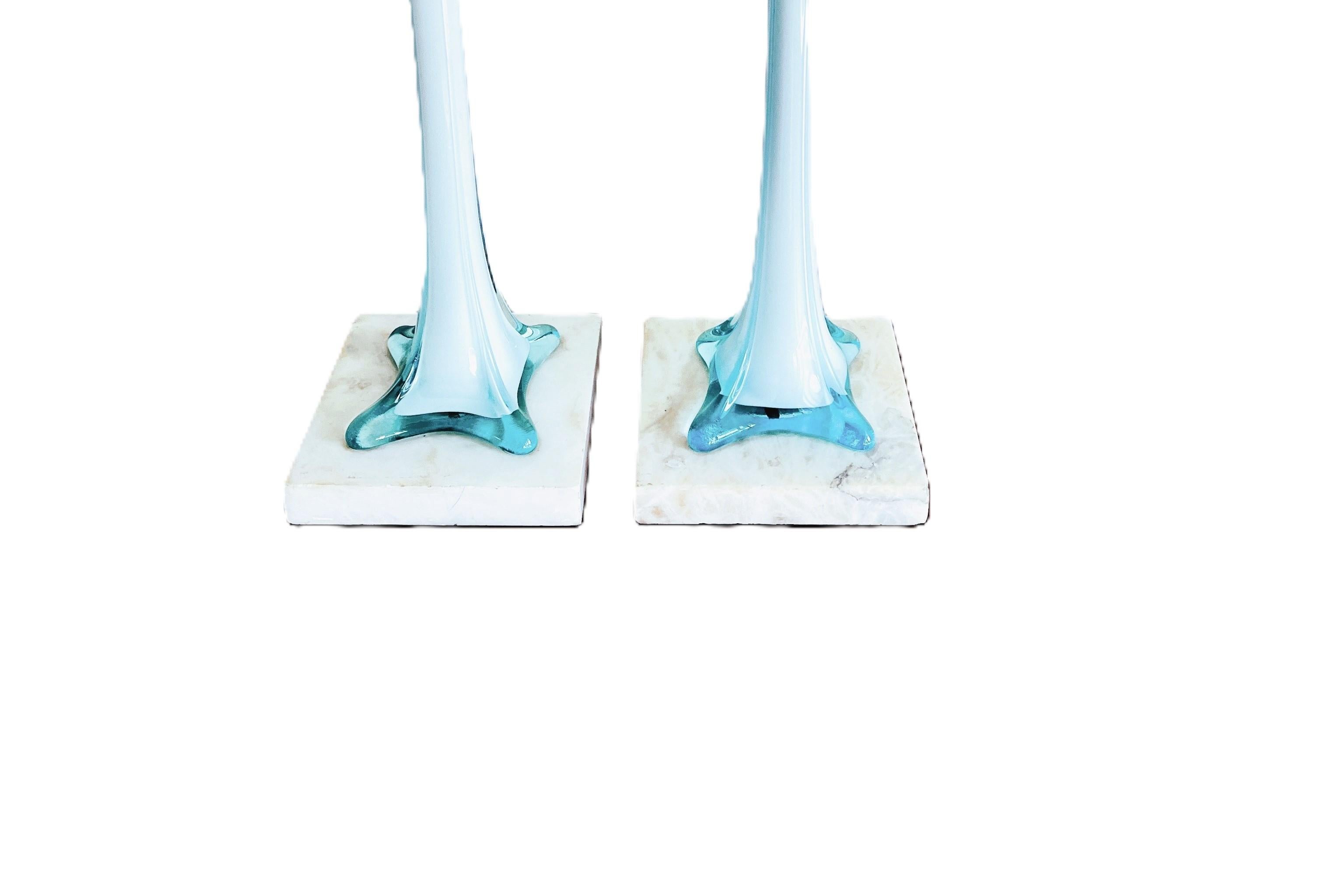 A stunning pair of tall Murano lamps on marble bases. 