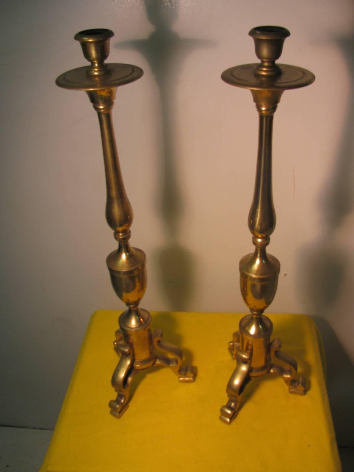 Simple and very elegant, large and tall, (2 ft.) pair of solid brass candleholders. Created with brass sections which fit perfectly. Can be polished or electrified for lamps for a fee.