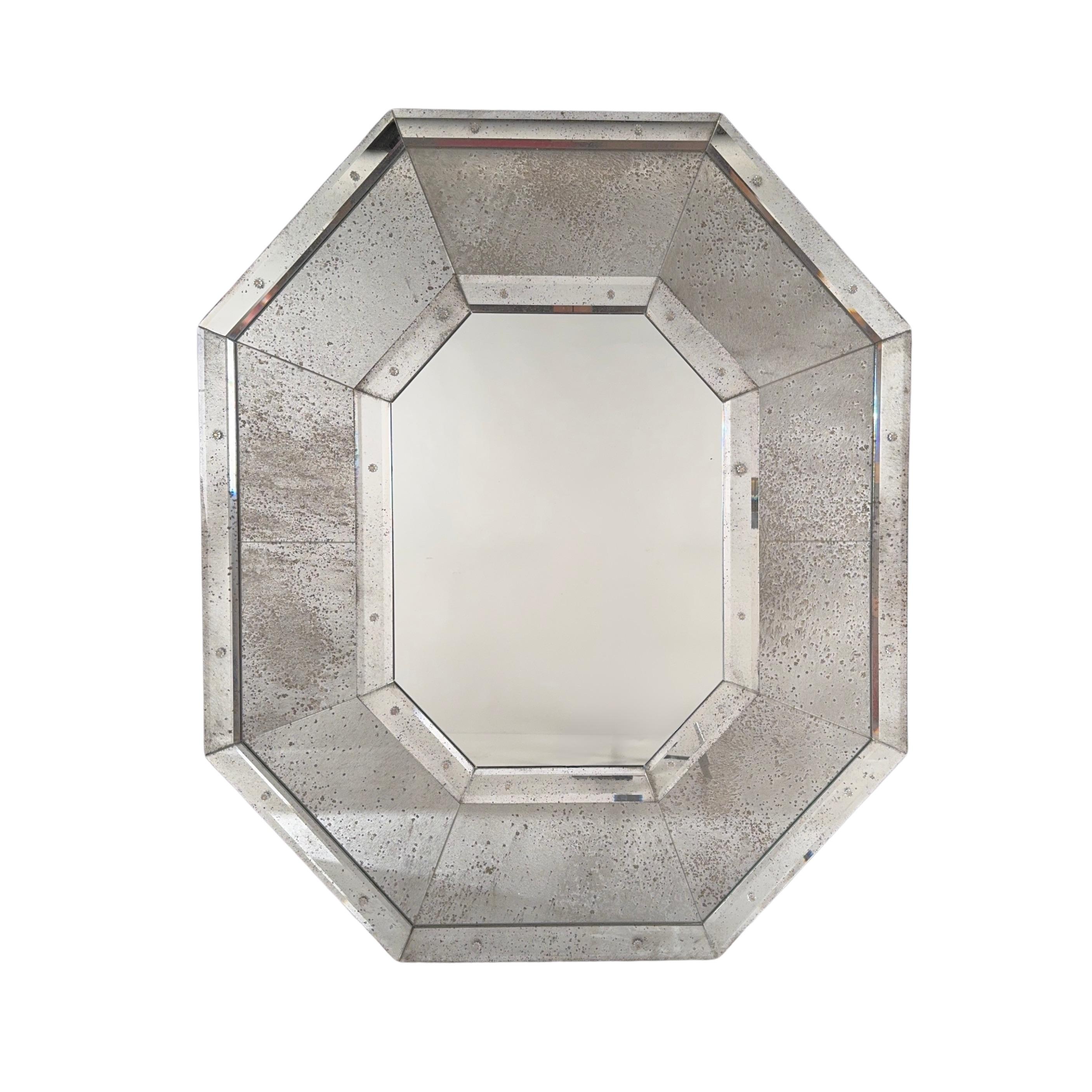 Pair of Tall Octogone™ mirrors by Design Frères®.
The beauty is in the details: antiqued mirror, beveled mirror, and rosettes.
Timeless Art Deco esthetic for the modern world.
Aluminum mounting brackets included.