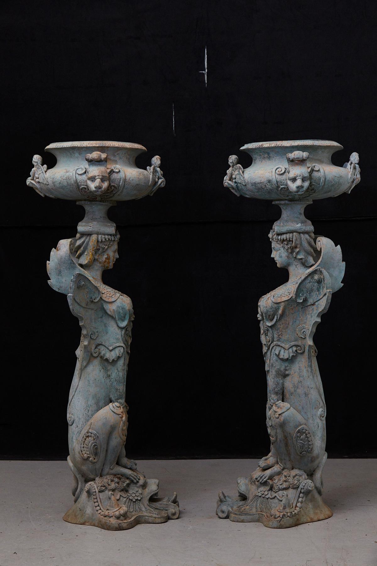 20th Century Pair of Tall Patinated Cast Iron Planters Showing Mythical Creatures / Chimeres