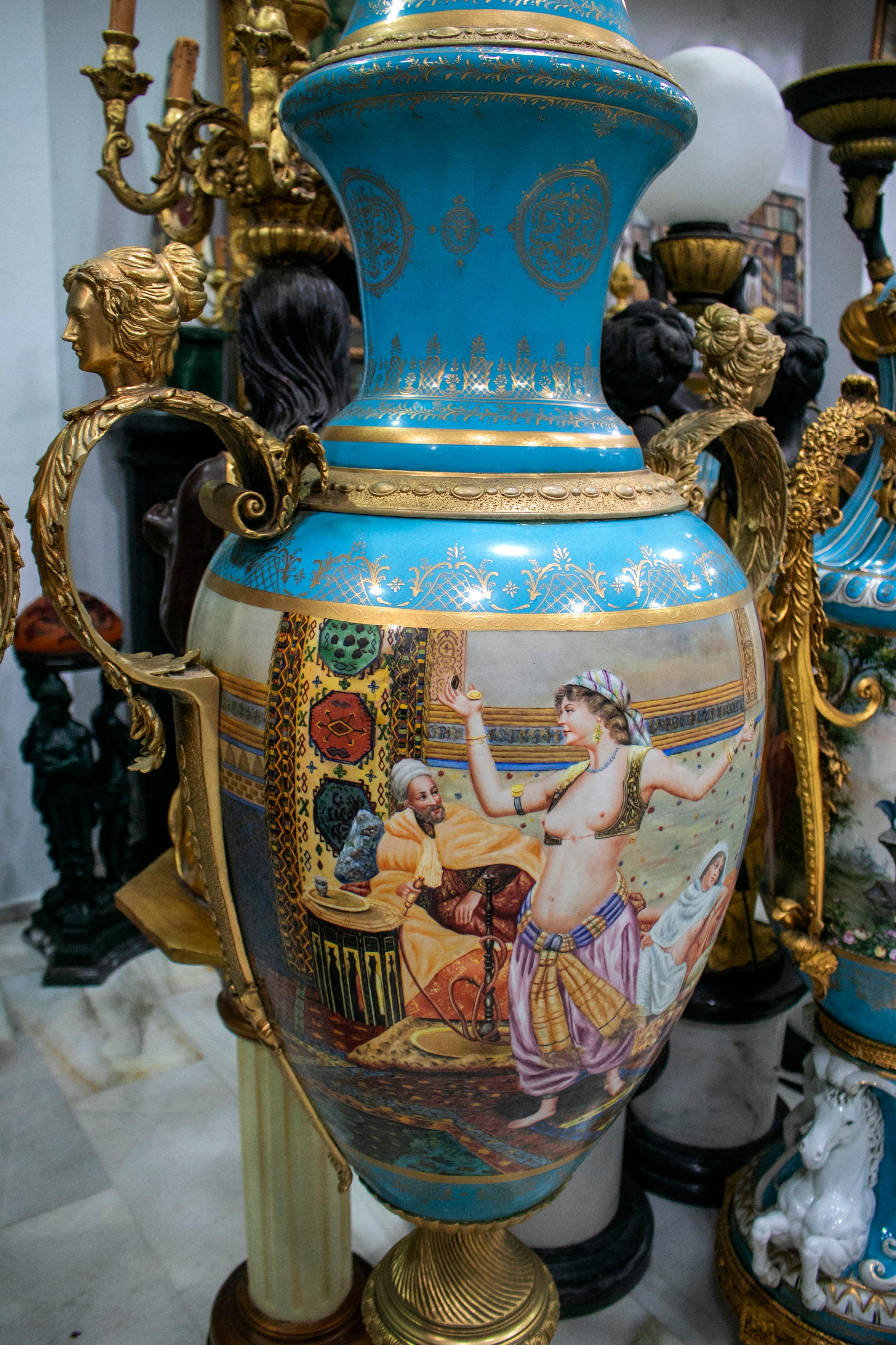 20th Century Pair of Tall Porcelain Urns Hand Painted with Orientalist Harem Scenes For Sale