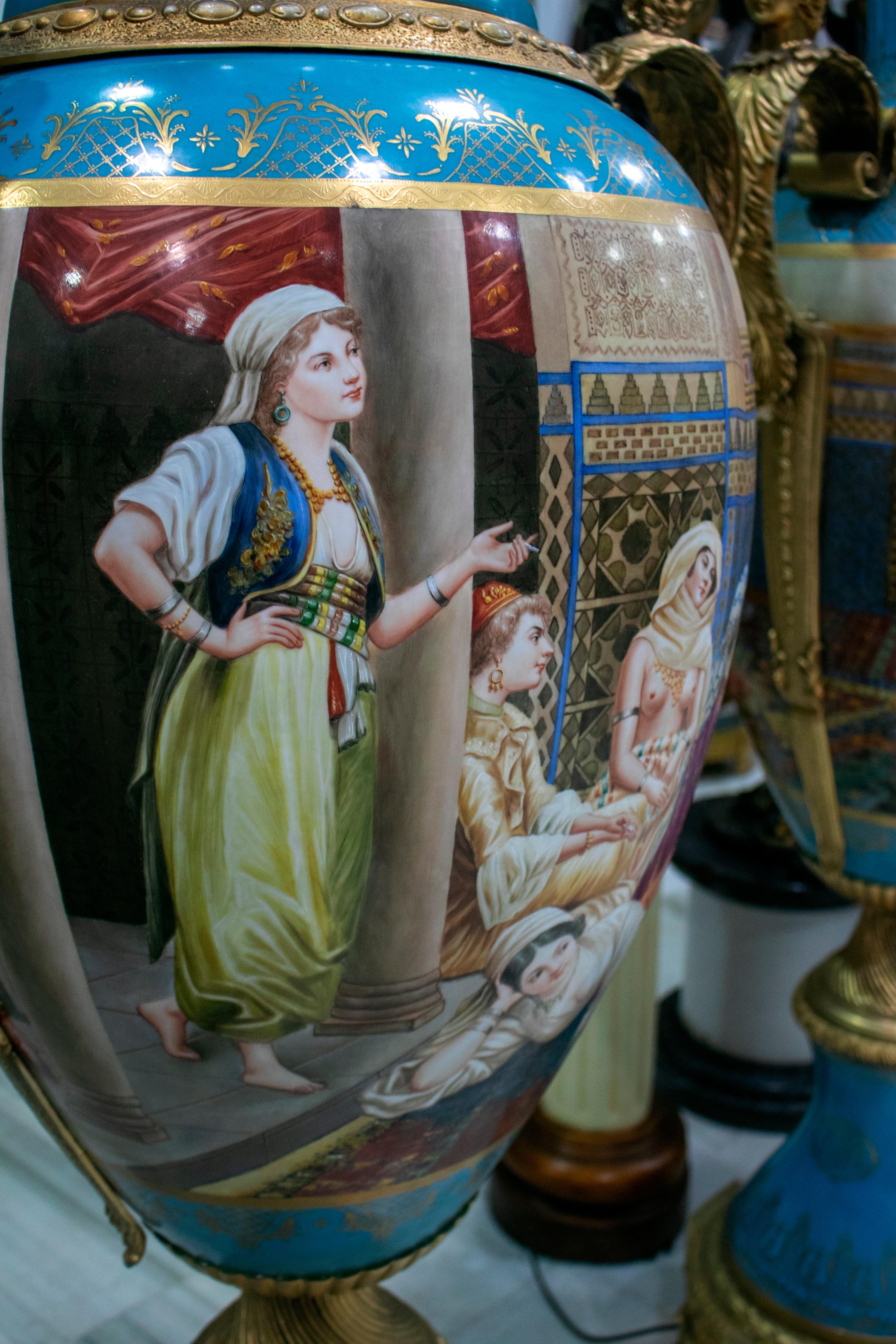 Pair of Tall Porcelain Urns Hand Painted with Orientalist Harem Scenes For Sale 1