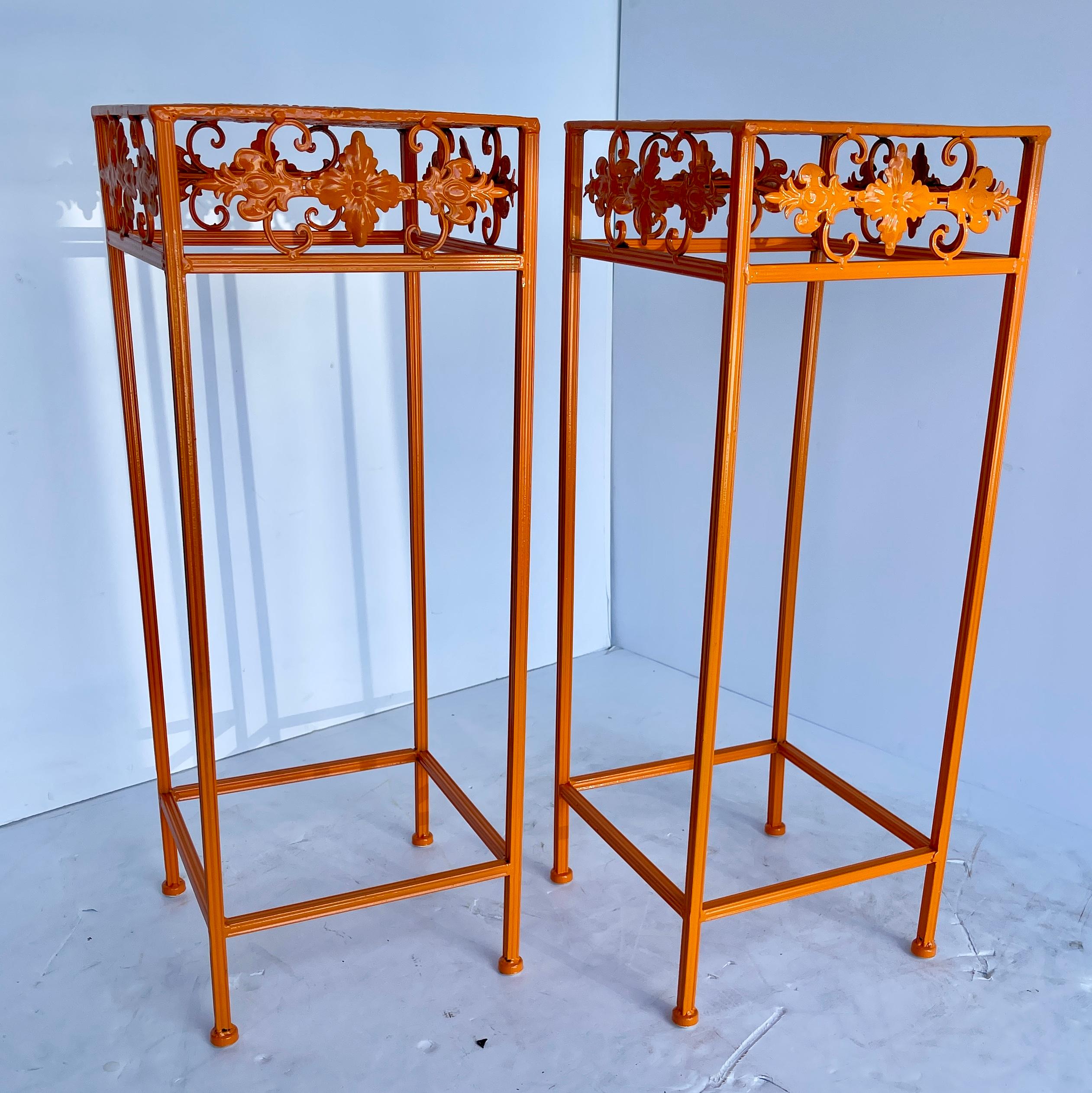 Mid-Century Modern plant stands. Feast your eyes on these exciting bold orange powder coated scrolled plant stands. Freshly powder-coated in Mid-Century Modern cheerful orange, the tall plant stands are perfect for indoor use or as a fun statement