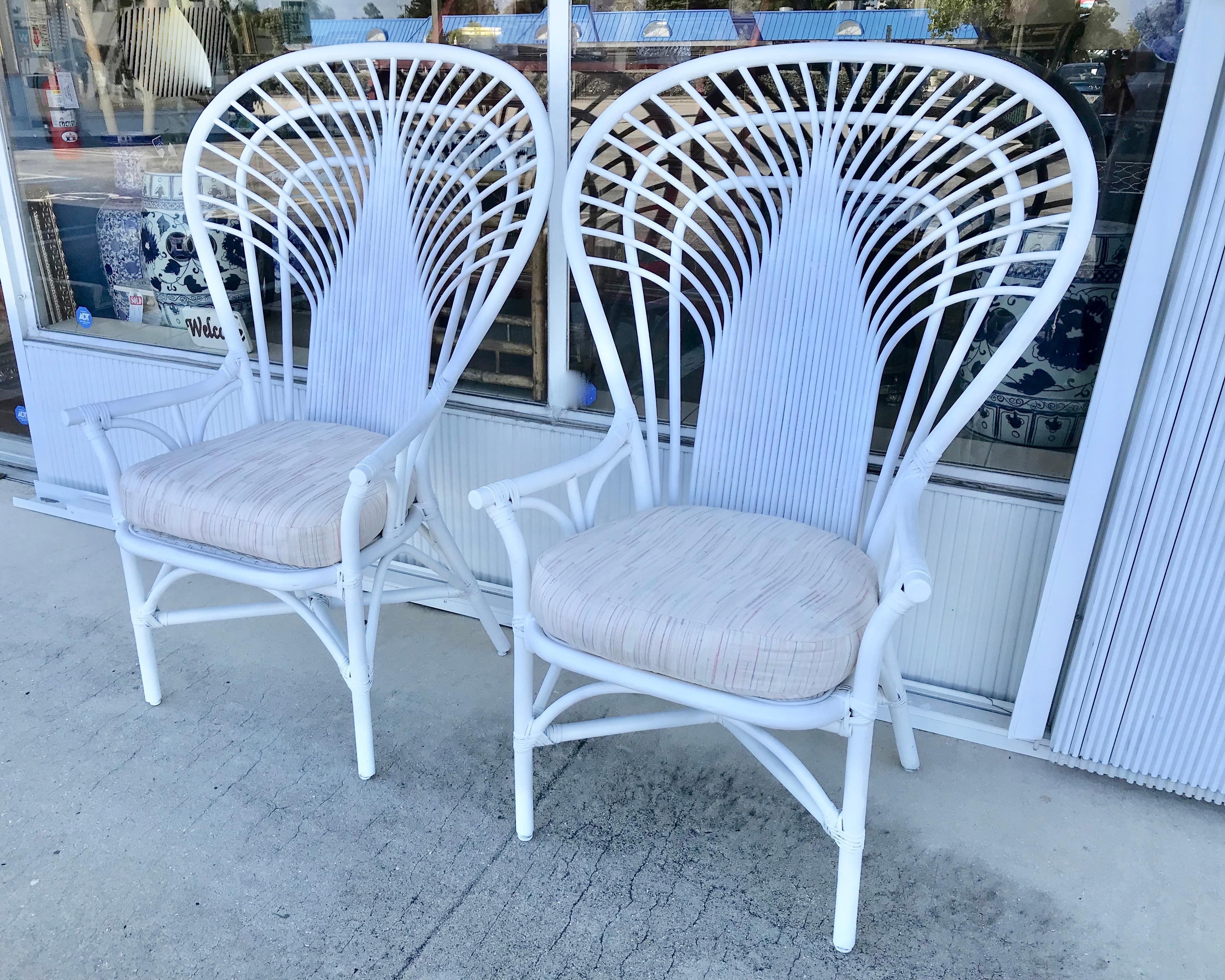 Dramatic in scale and form -unusual design akin to
the Classic peacock chair, but much more durable.
The finish is a satin white. Height of seats without
cushions is 17.25