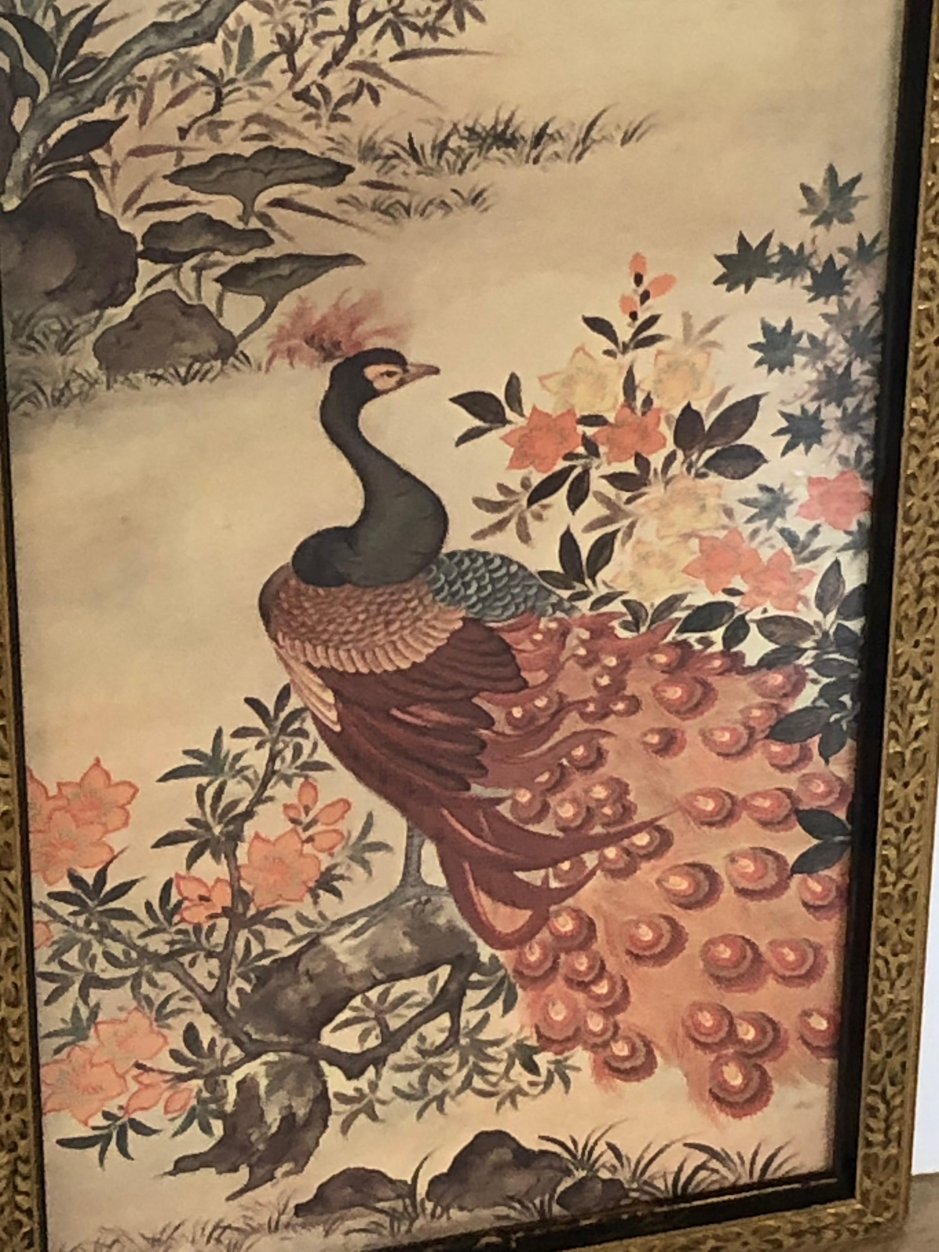 Lovely vintage pair of tall rectangular Asian style prints having exotic birds and foliage in a muted color palette and original aged giltwood frames.