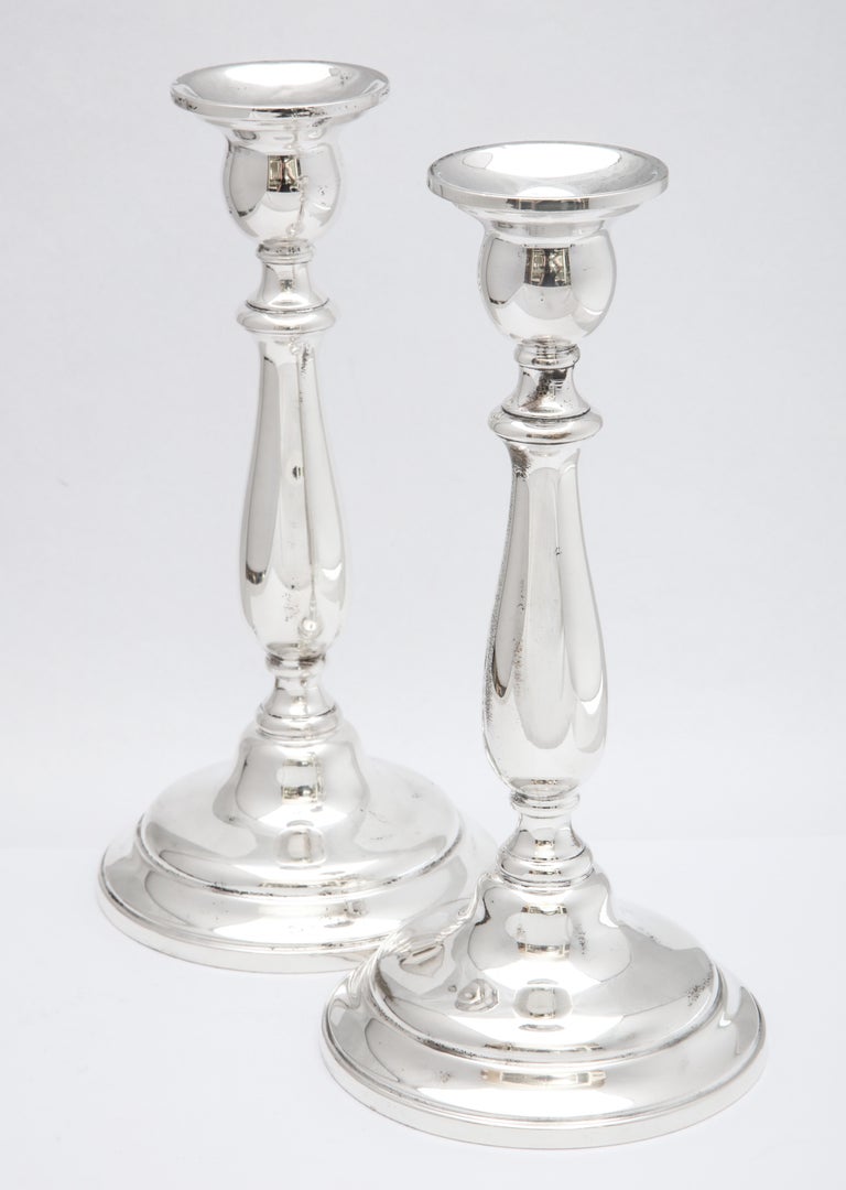 Early 20th Century Pair of Tall Sterling Silver Empire-Style Candlesticks For Sale