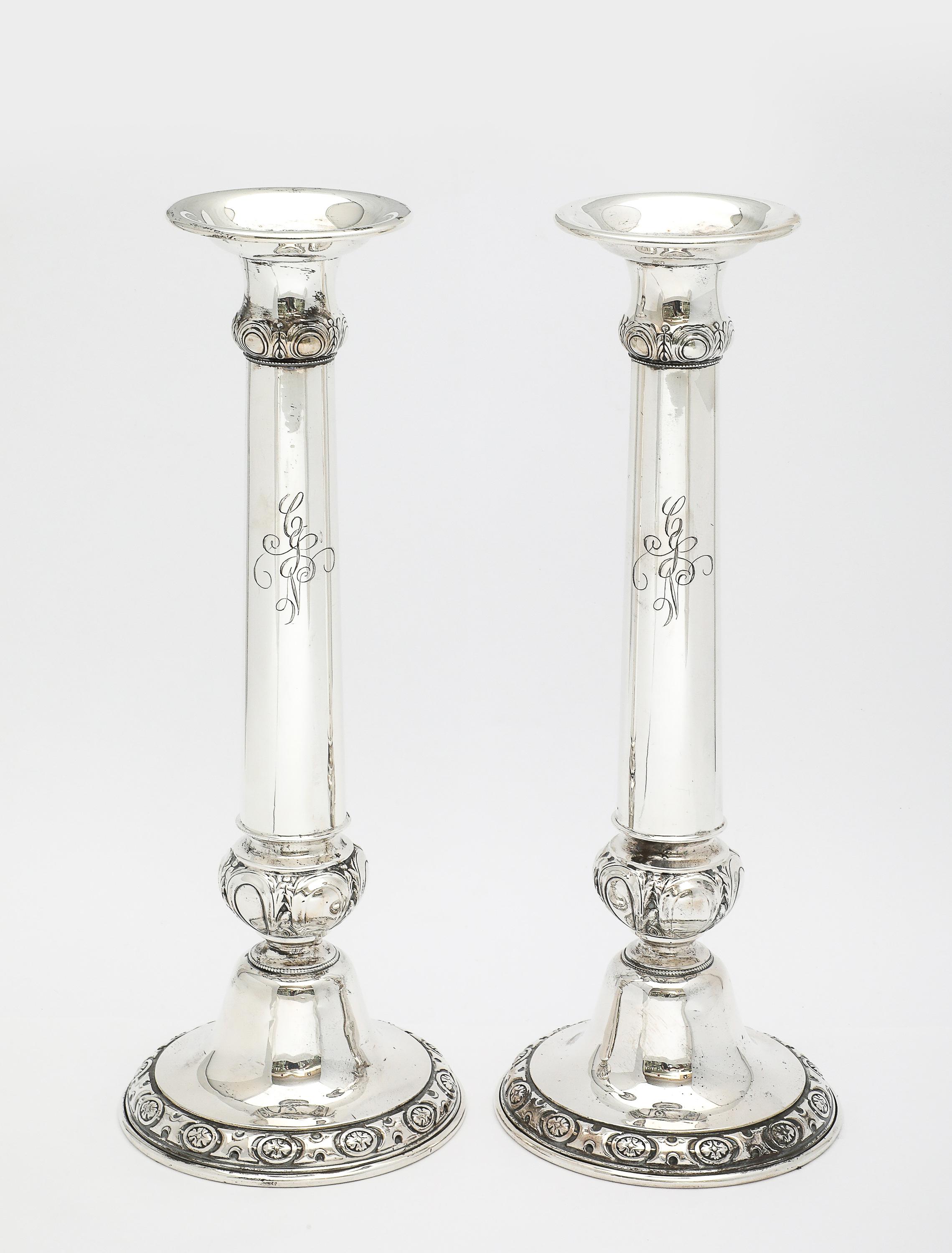 Pair of tall, sterling silver, Neoclassical candlesticks, produced by the Whiting Mfg. Co. (when it temporarily merged with the Gorham Mfg. Co. in the 1920's), Providence, Rhode Island, year-hallmarked with the Gorham year-mark for 1925 and bearing