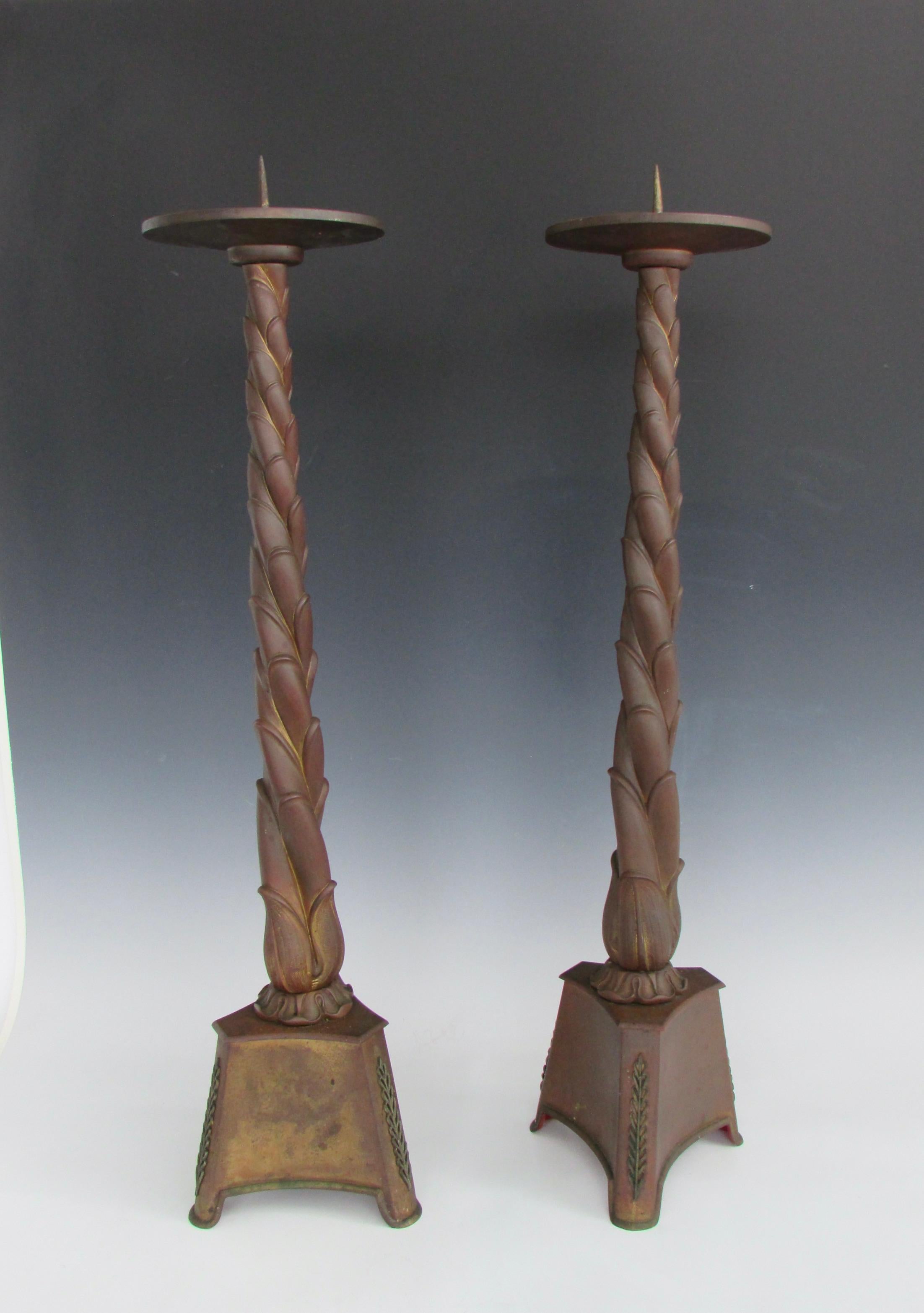 Large scale gothic bronze candle sticks. Twist column on triangle base holds large sconce dish top. 30.75
