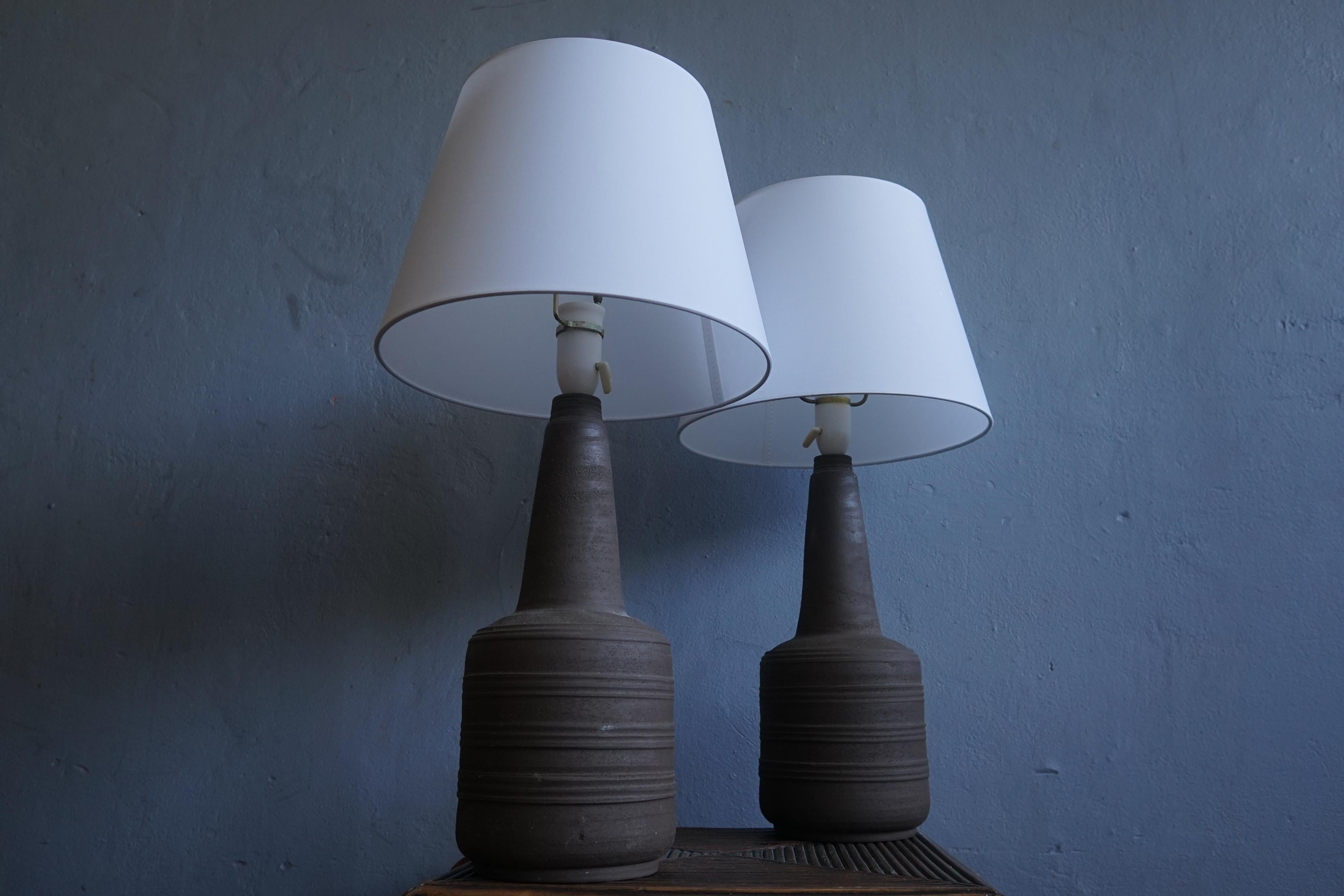 Pair of tall unglazed ceramic Brutalist lamps manufactured in the 1970s by a unknown Danish manufacturer 


Brutalist architecture is an architectural style that emerged during the 1950s in the United Kingdom, among the reconstruction projects of