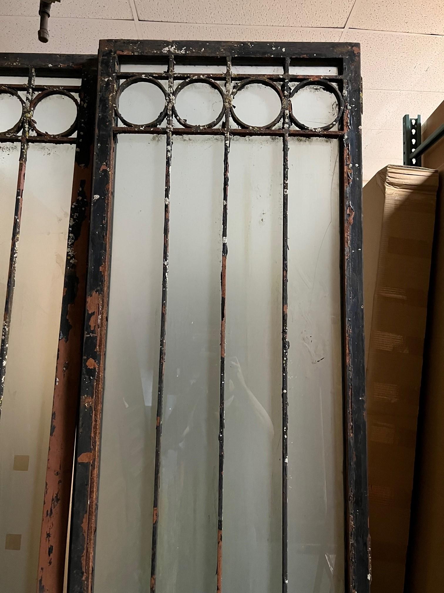 Pair of Tall Vintage Iron Doors with Frosted Glass  In Fair Condition For Sale In Stamford, CT